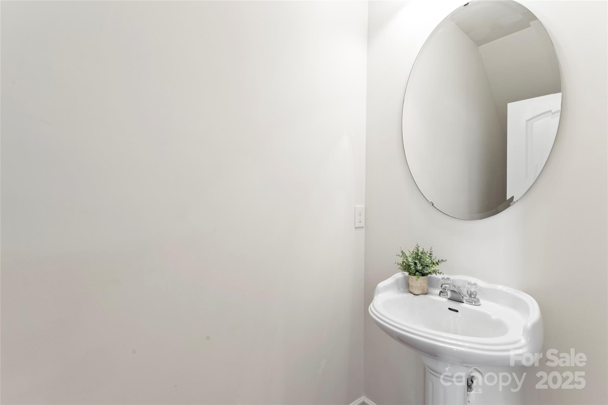 5678 Stafford Road Charlotte, NC 28215 - Photo 14 of 43 a bathroom with a sink and a mirror