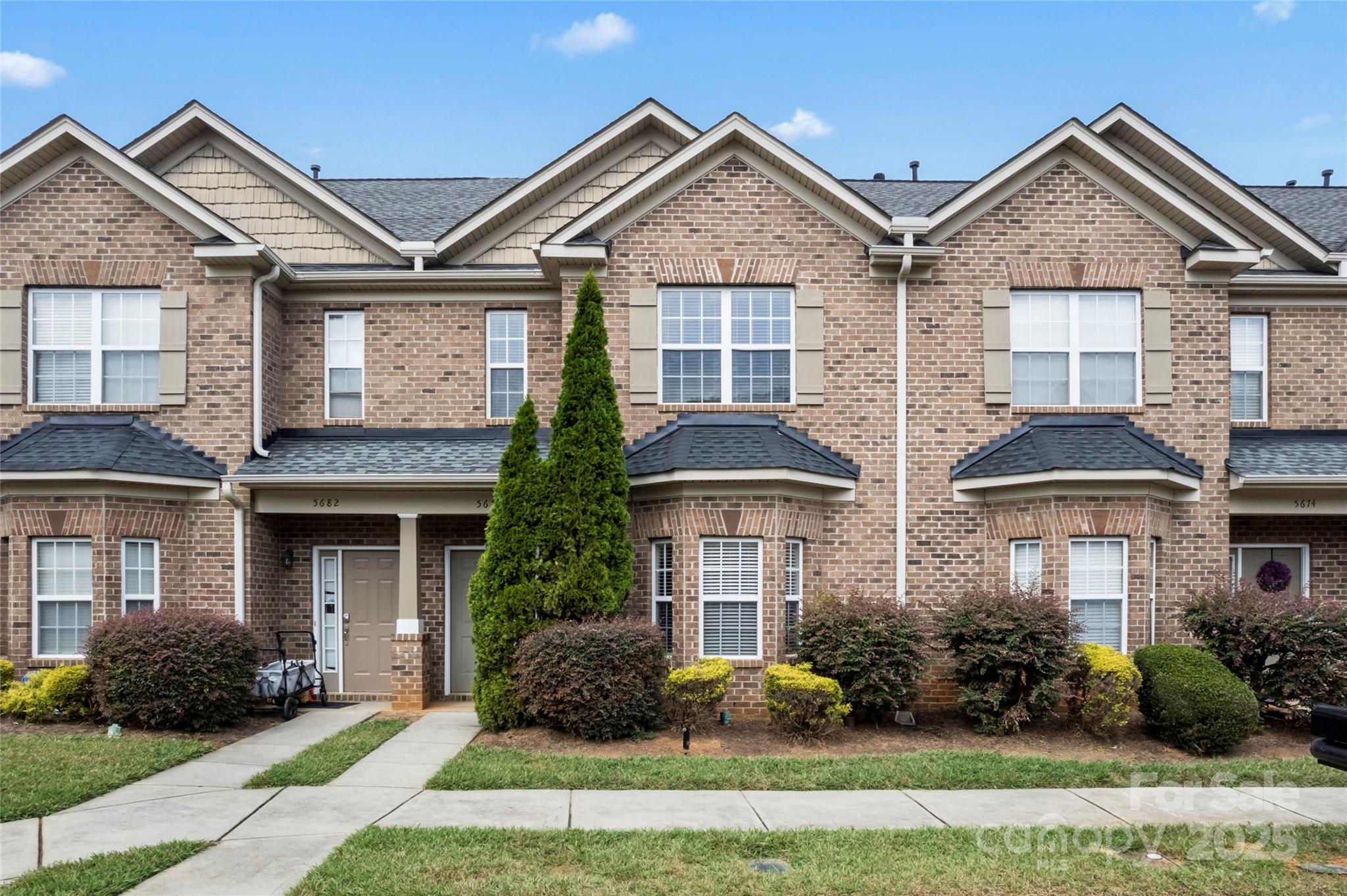 5678 Stafford Road Charlotte, NC 28215 - Photo 2 of 43 a front view of a house with yard and plants