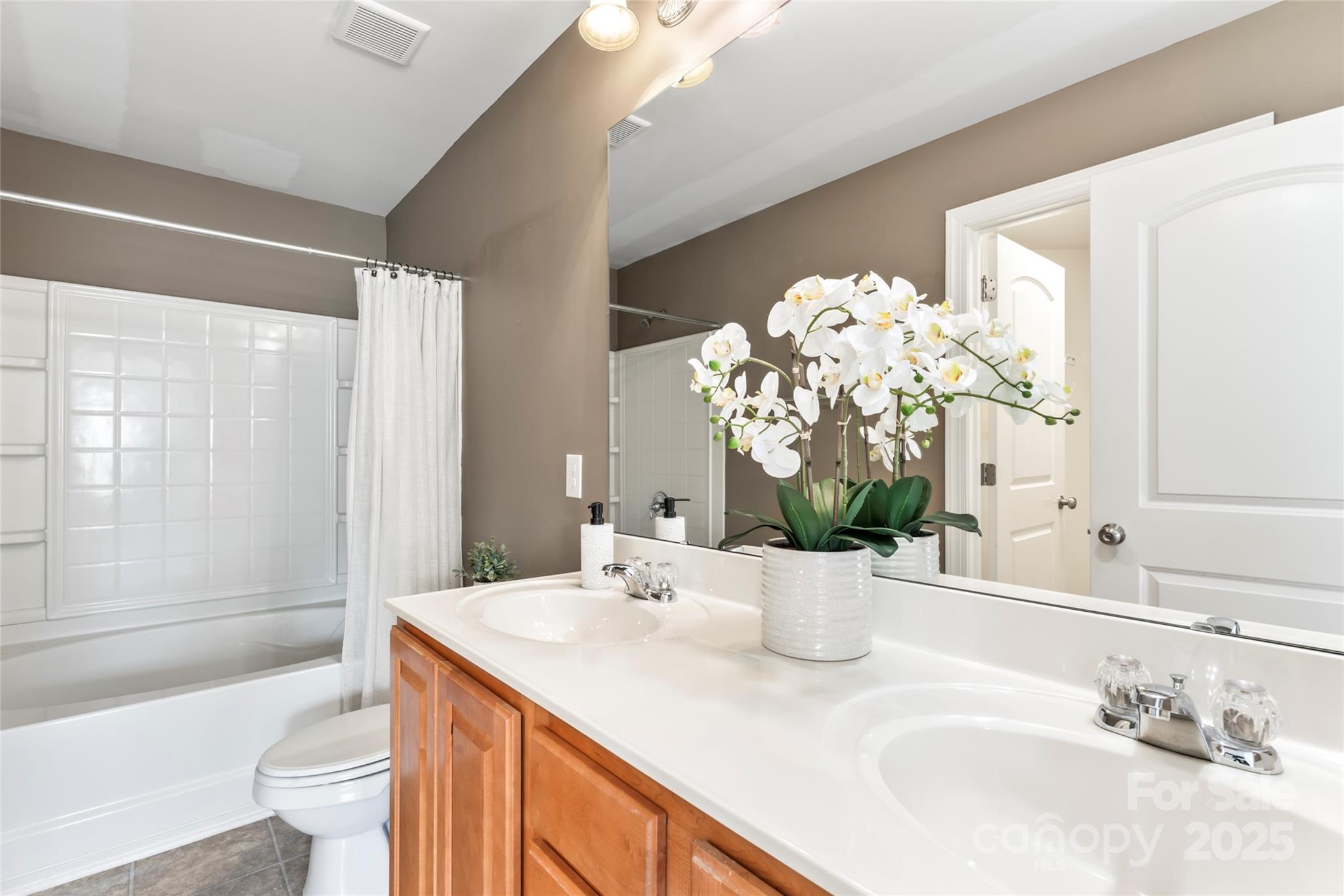 5678 Stafford Road Charlotte, NC 28215 - Photo 26 of 43 a bathroom with a granite countertop sink a toilet and shower