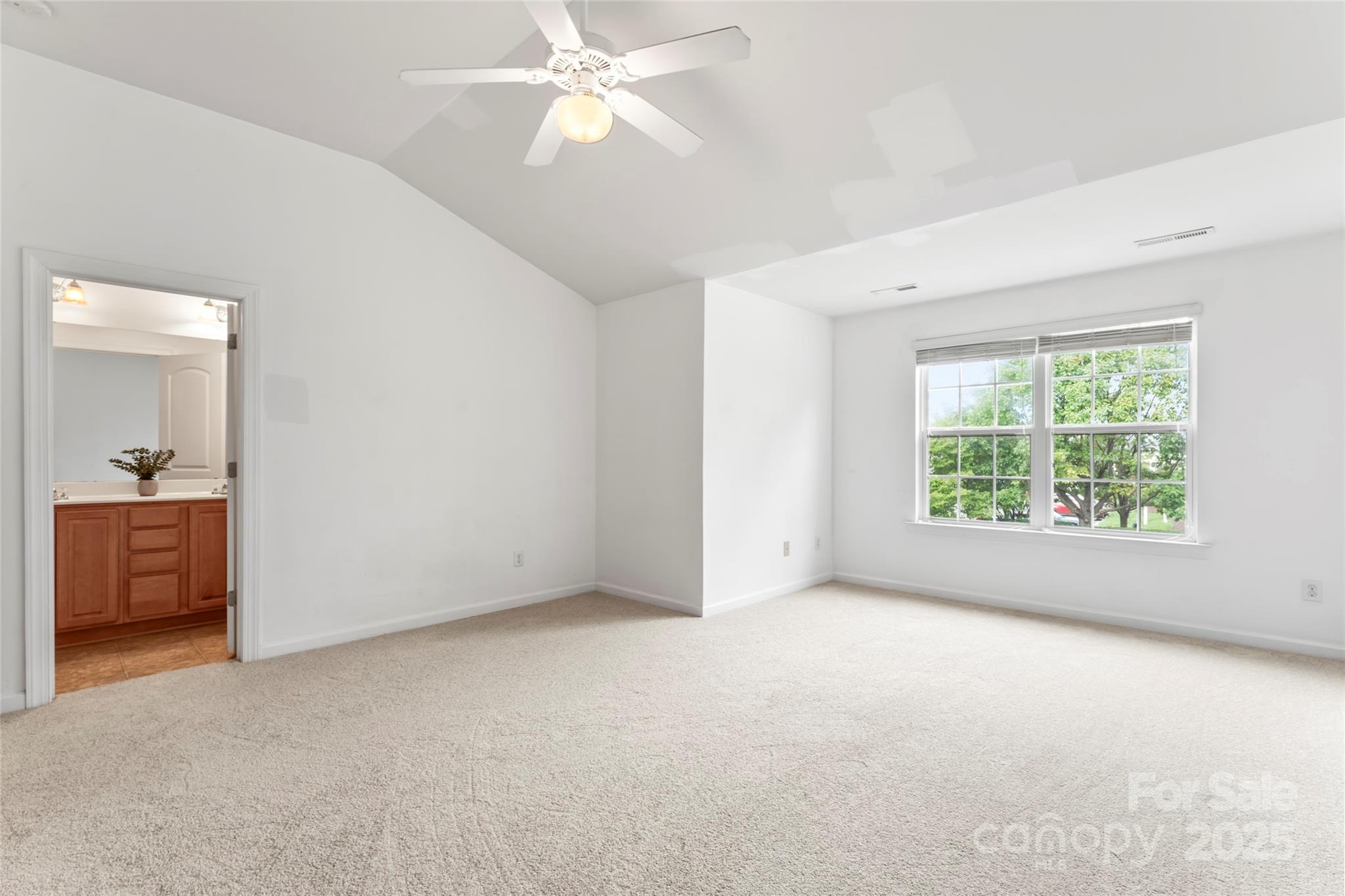 5678 Stafford Road Charlotte, NC 28215 - Photo 32 of 43 an empty room with a window and a fan