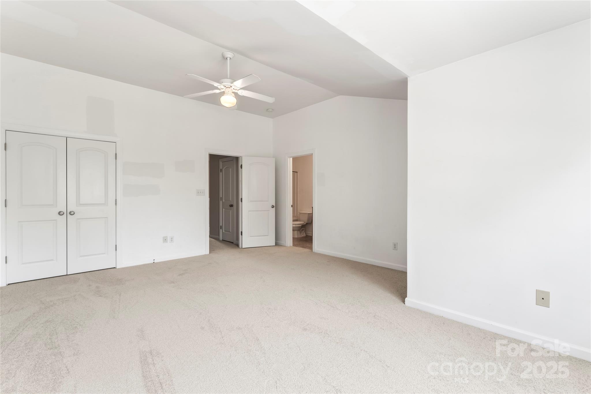 5678 Stafford Road Charlotte, NC 28215 - Photo 33 of 43 an empty room with a ceiling fan and closet