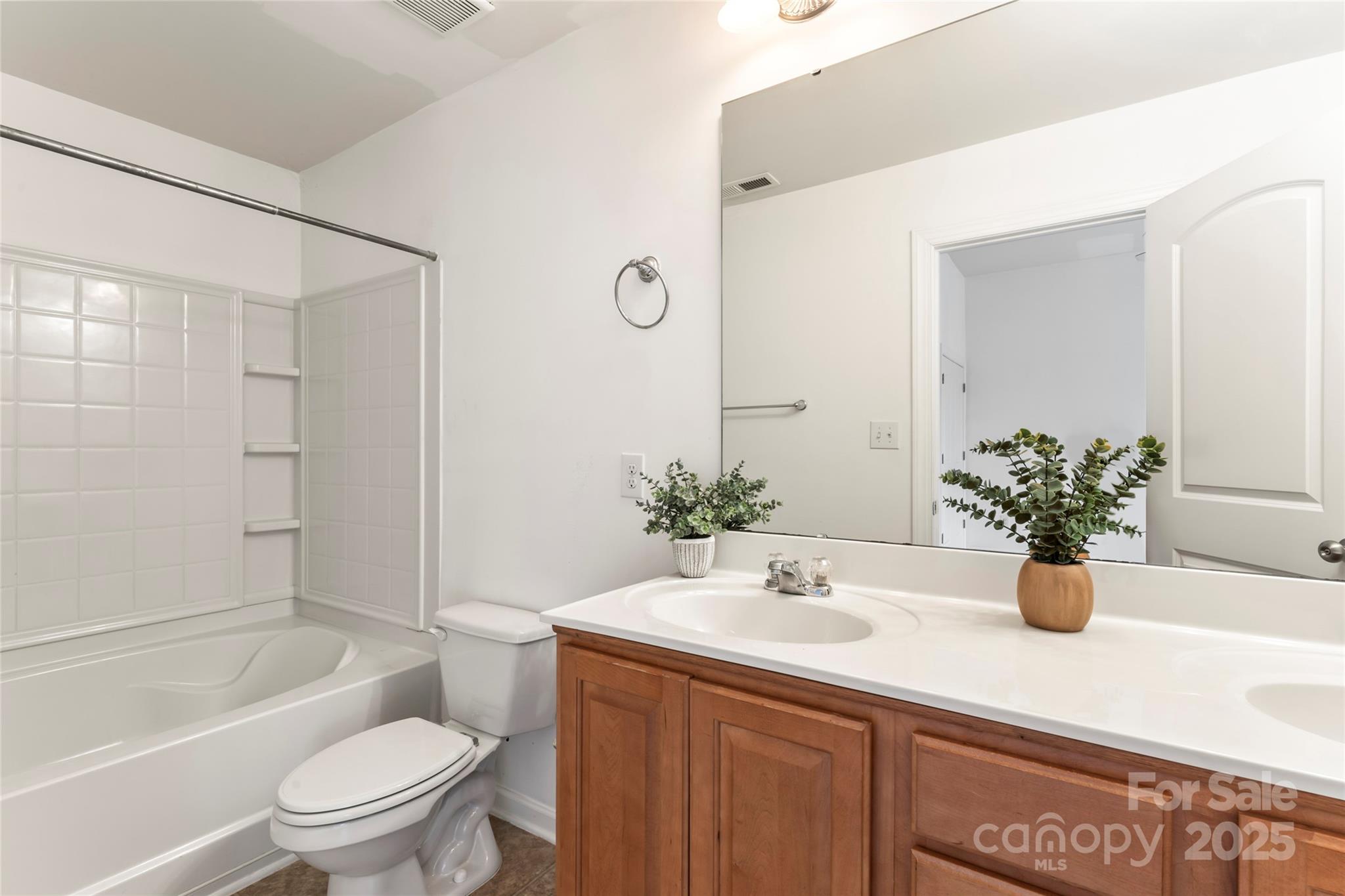 5678 Stafford Road Charlotte, NC 28215 - Photo 35 of 43 a bathroom with a sink a toilet and shower