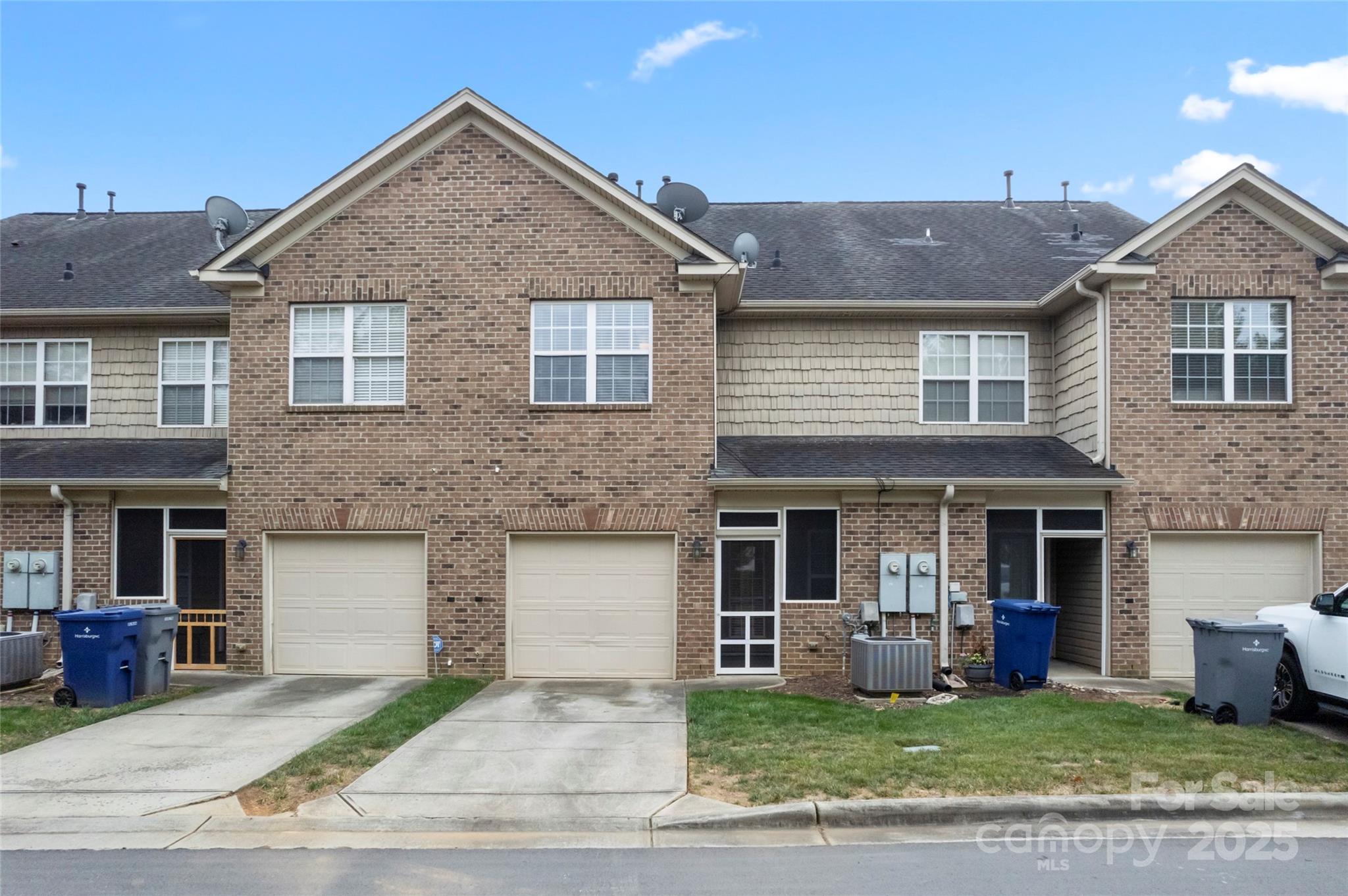 5678 Stafford Road Charlotte, NC 28215 - Photo 36 of 43 a front view of a house with a yard and garage