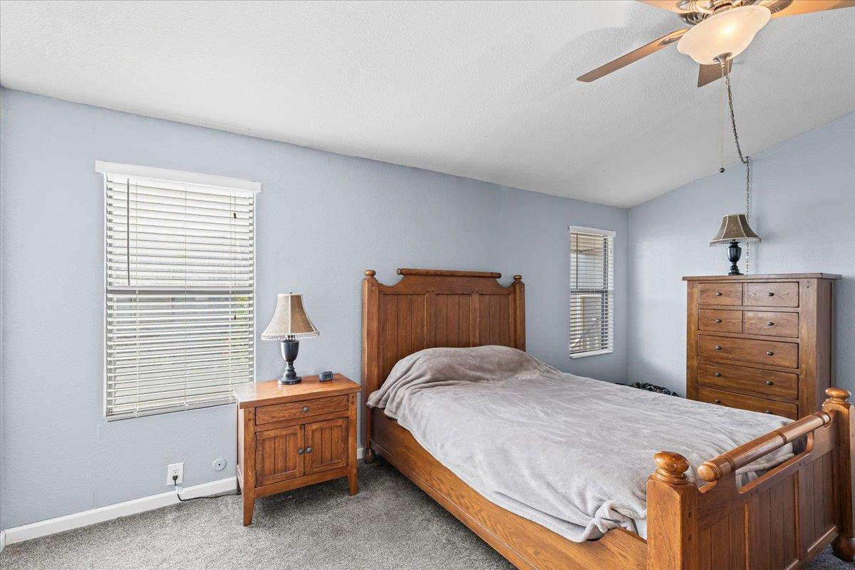1500 Held Drive, Unit 79 Modesto, CA 95355 - Photo 21 of 58 a bedroom with a bed and furniture