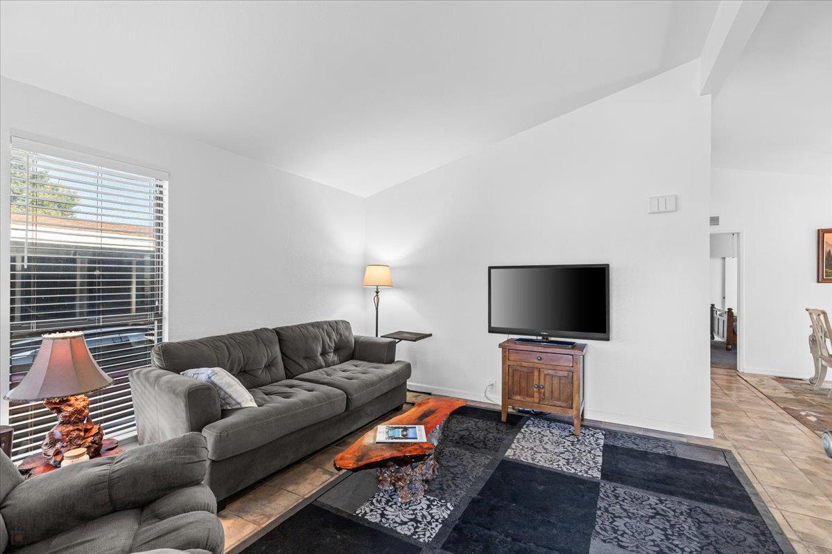1500 Held Drive, Unit 79 Modesto, CA 95355 - Photo 4 of 58 a living room with furniture and a flat screen tv