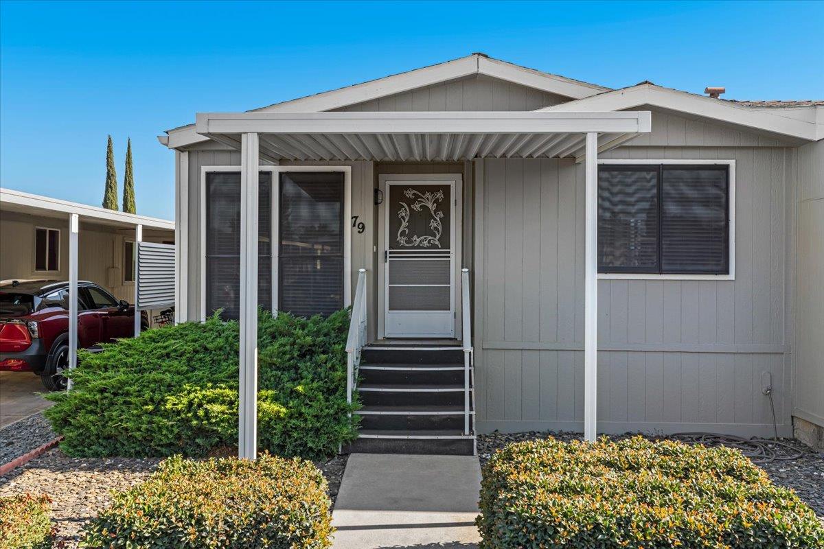 1500 Held Drive, Unit 79 Modesto, CA 95355 - Photo 57 of 58 a front view of a house with garden