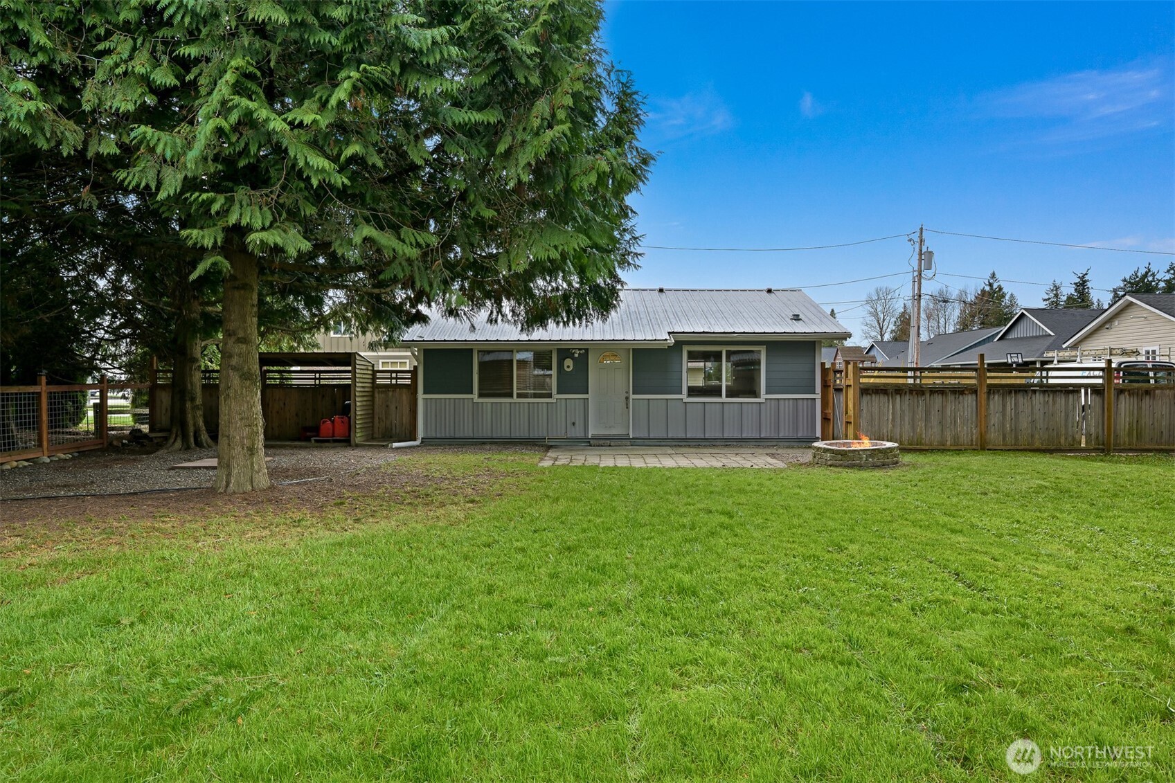 310 West 3rd Street Nooksack, WA 98276 - Photo 24 of 34 a view of a house with backyard and sitting area