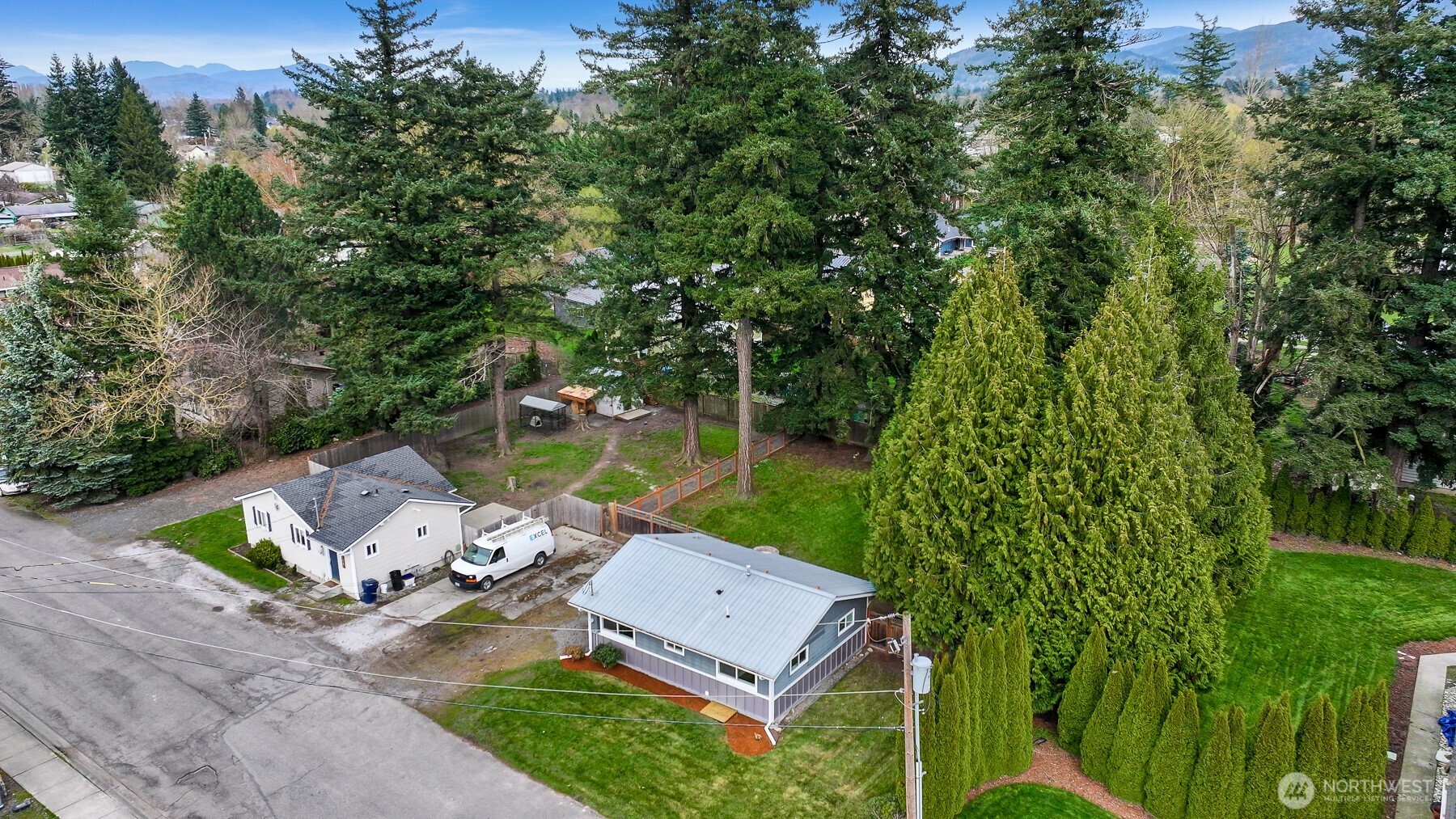 310 West 3rd Street Nooksack, WA 98276 - Photo 31 of 34 an aerial view of a house with swimming pool and garden