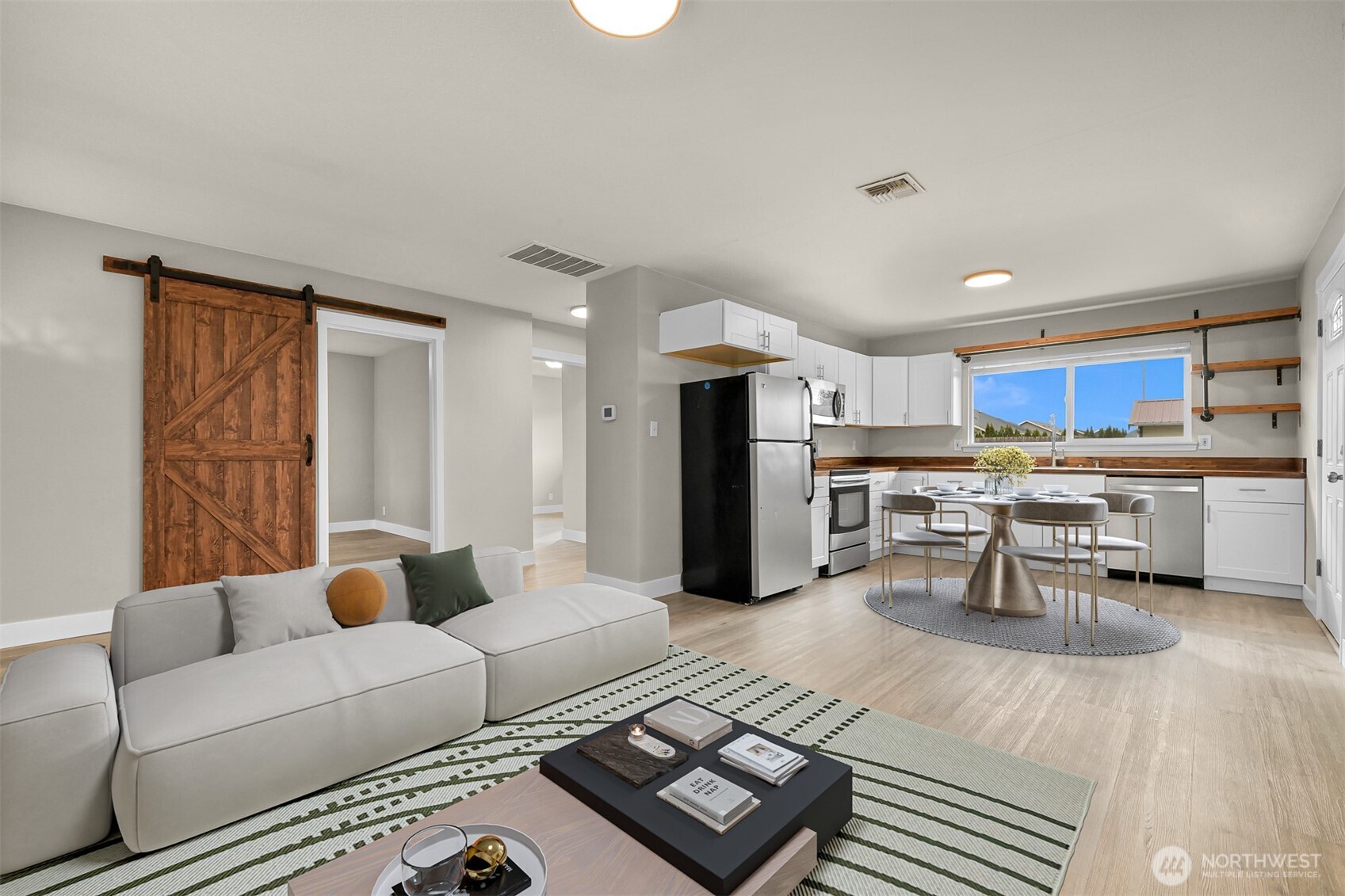 310 West 3rd Street Nooksack, WA 98276 - Photo 10 of 34 a living room with furniture and kitchen view