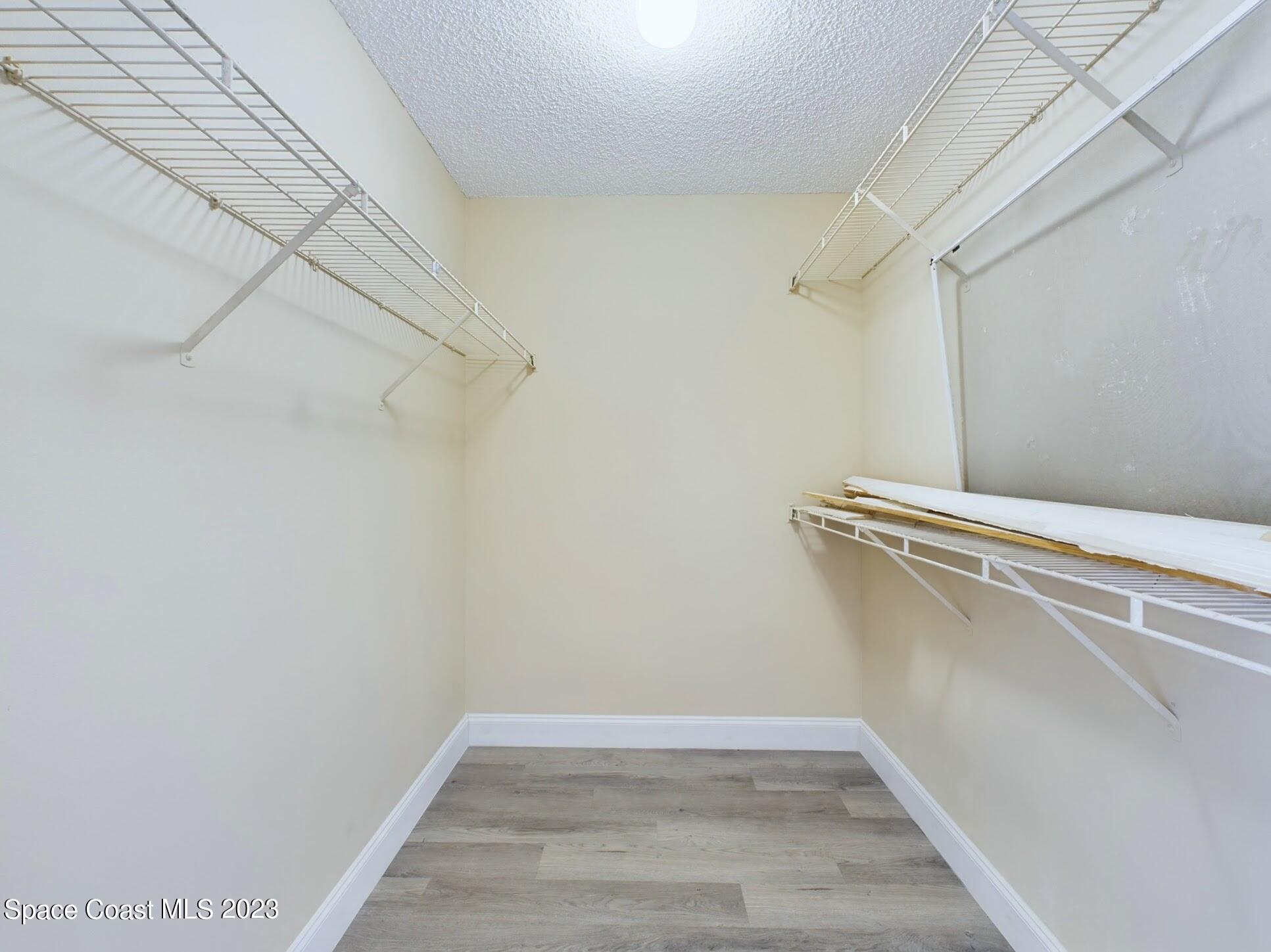 248 Benchor Road Northwest Palm Bay, FL 32907 - Photo 16 of 31 a view of a room with racks on the wall