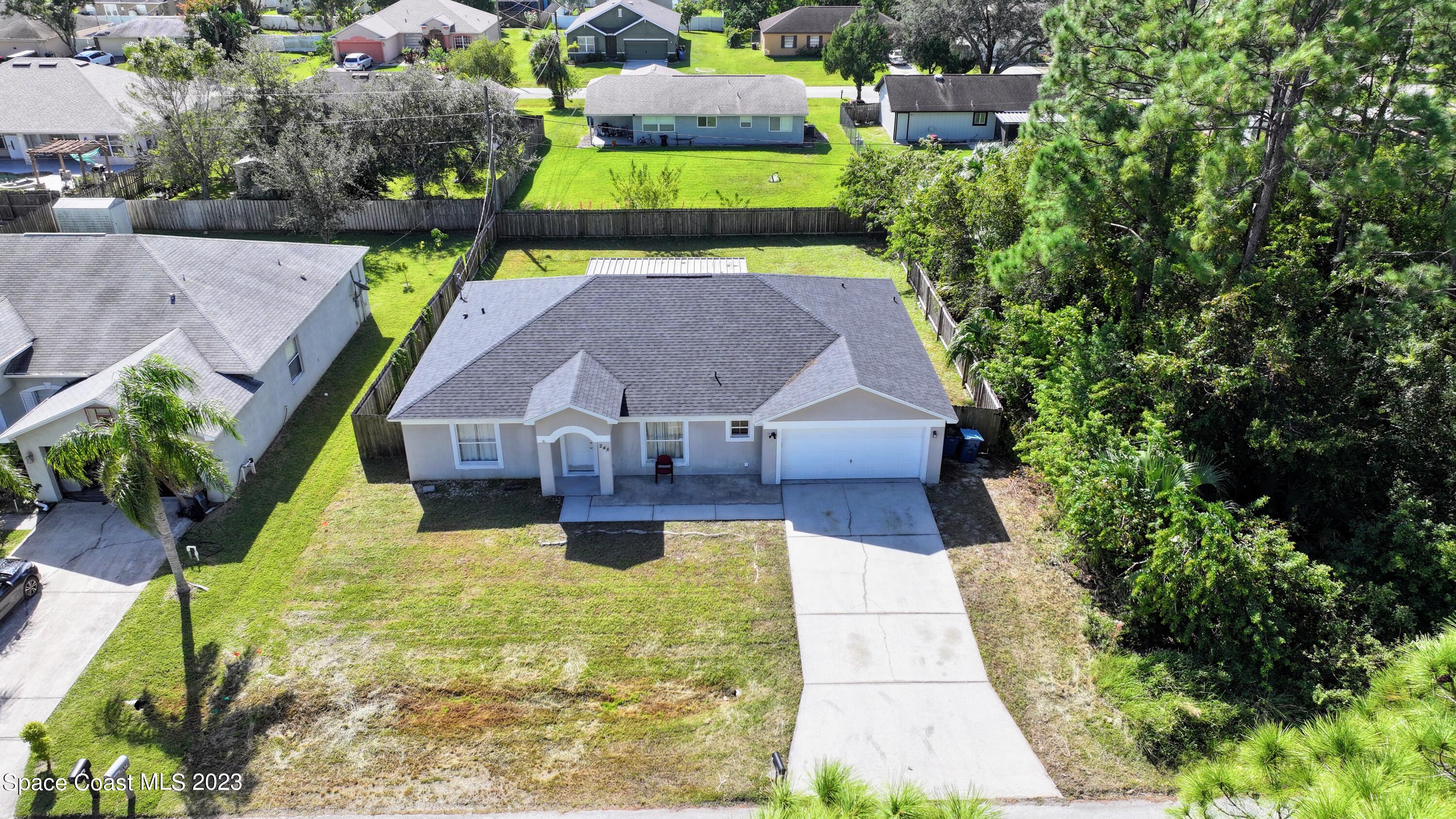 248 Benchor Road Northwest Palm Bay, FL 32907 - Photo 2 of 31 an aerial view of a house