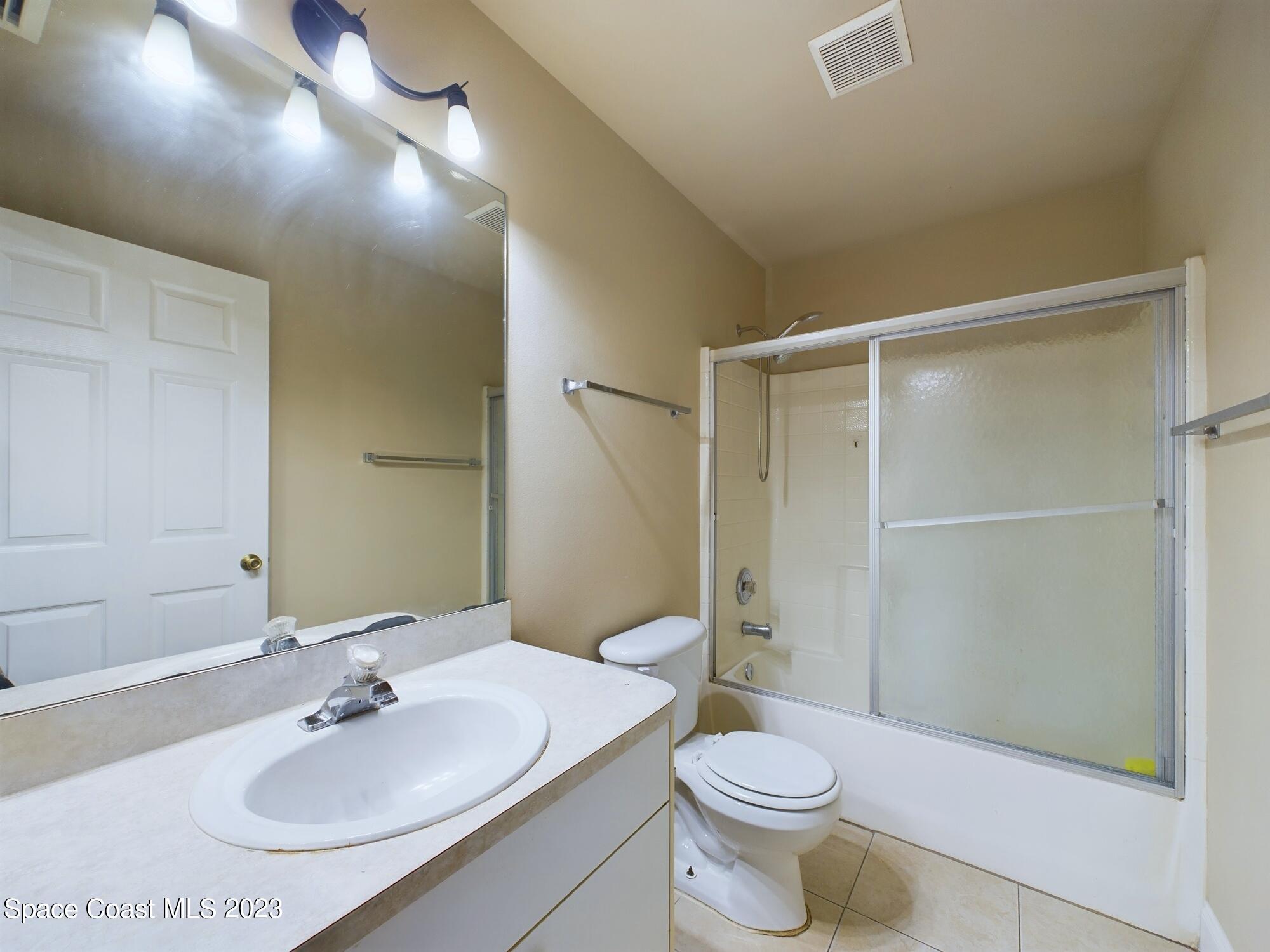 248 Benchor Road Northwest Palm Bay, FL 32907 - Photo 21 of 31 a bathroom with a sink toilet and shower