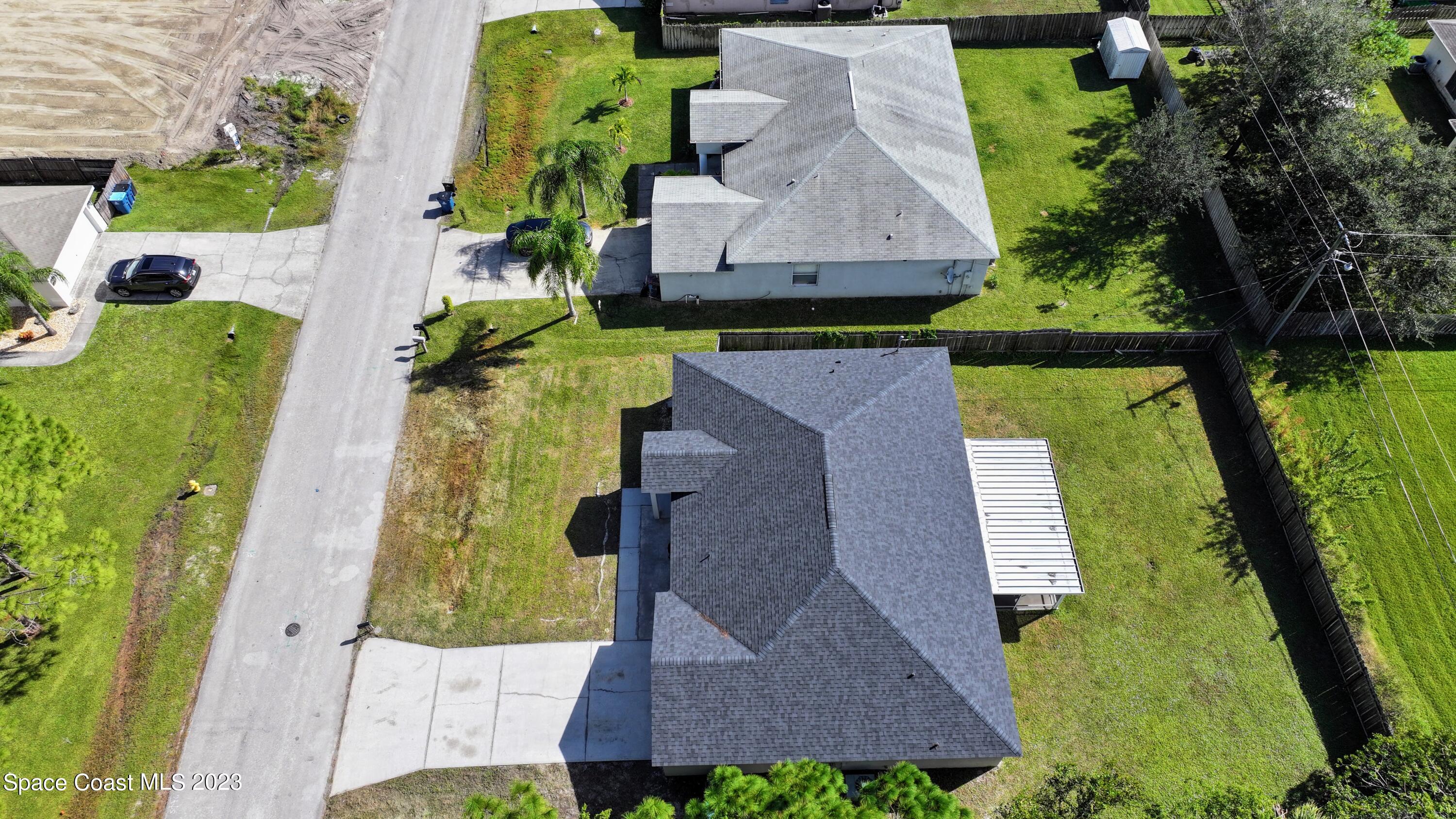 248 Benchor Road Northwest Palm Bay, FL 32907 - Photo 26 of 31 an aerial view of a house with garden space ocean swimming pool and outdoor seating