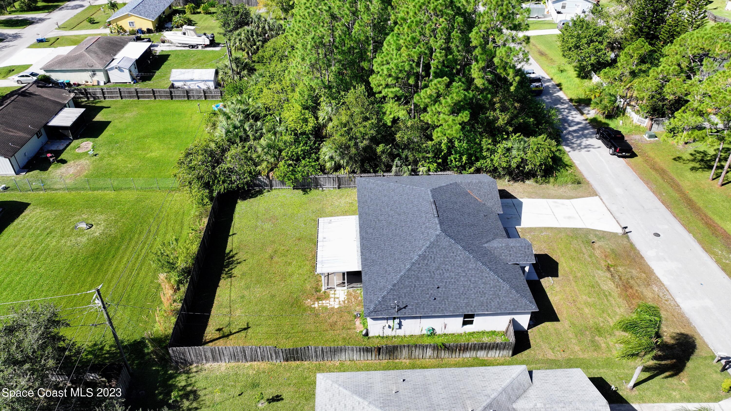 248 Benchor Road Northwest Palm Bay, FL 32907 - Photo 27 of 31 an aerial view of a house with a yard