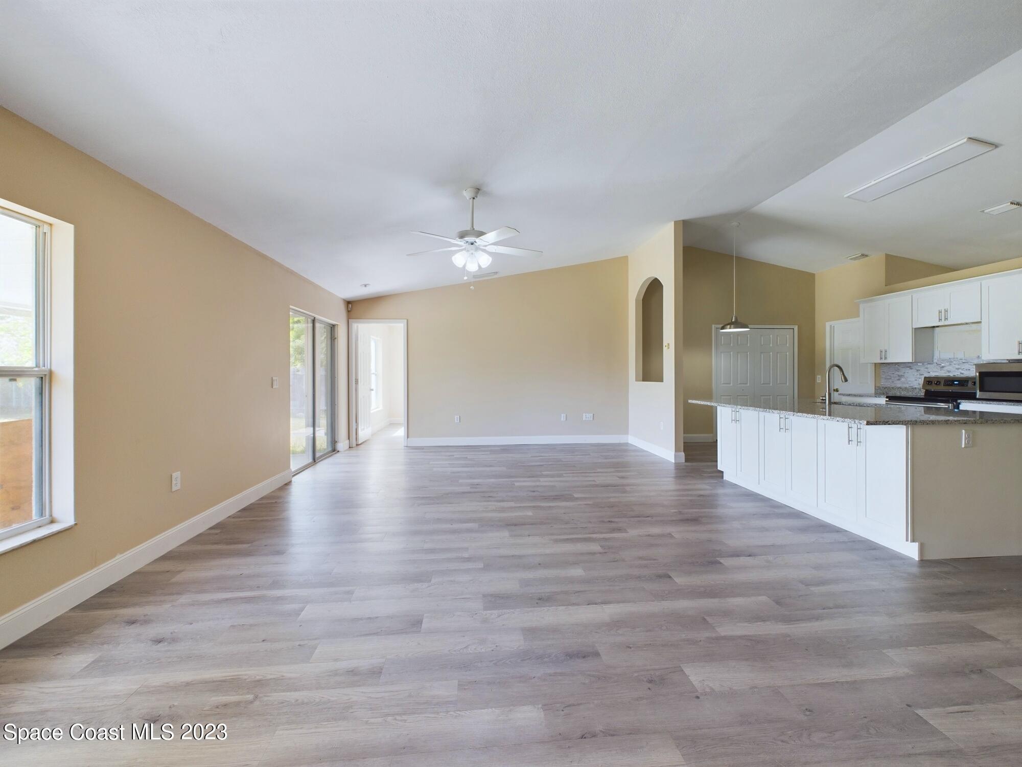 248 Benchor Road Northwest Palm Bay, FL 32907 - Photo 10 of 31 a view of a kitchen with a sink and cabinets