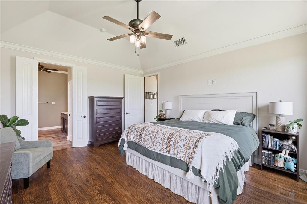 160 Vista Ridge North Decatur, TX 76234 - Photo 21 of 40 a bedroom with a bed chandelier and a view of bedroom