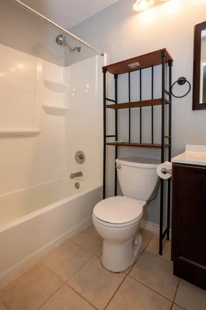 a bathroom with a toilet a sink and a bathtub