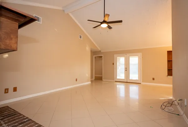 a view of an empty room with a window