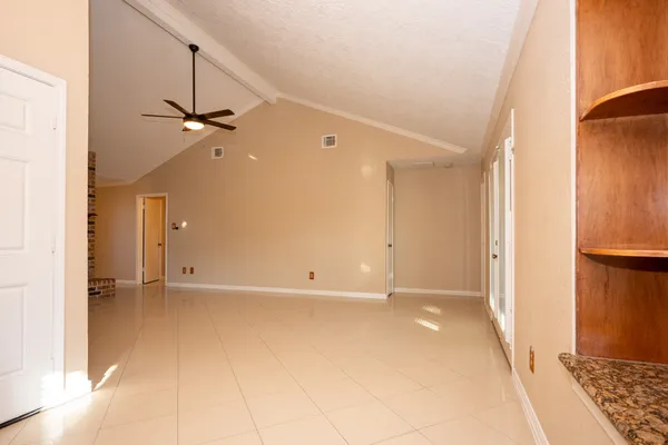 a view of an empty room with a window