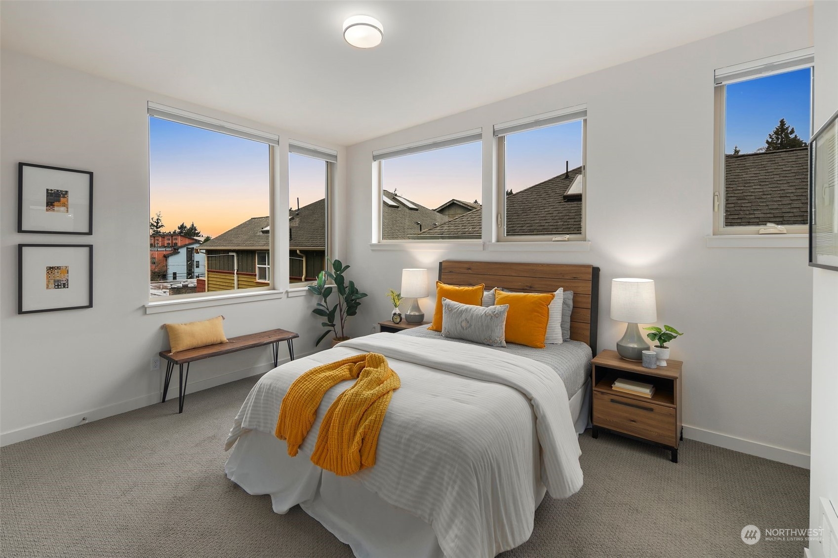 3625 Evanston Avenue North, Unit B Seattle, WA 98103 - Photo 15 of 37 a bedroom with a bed and wooden floor