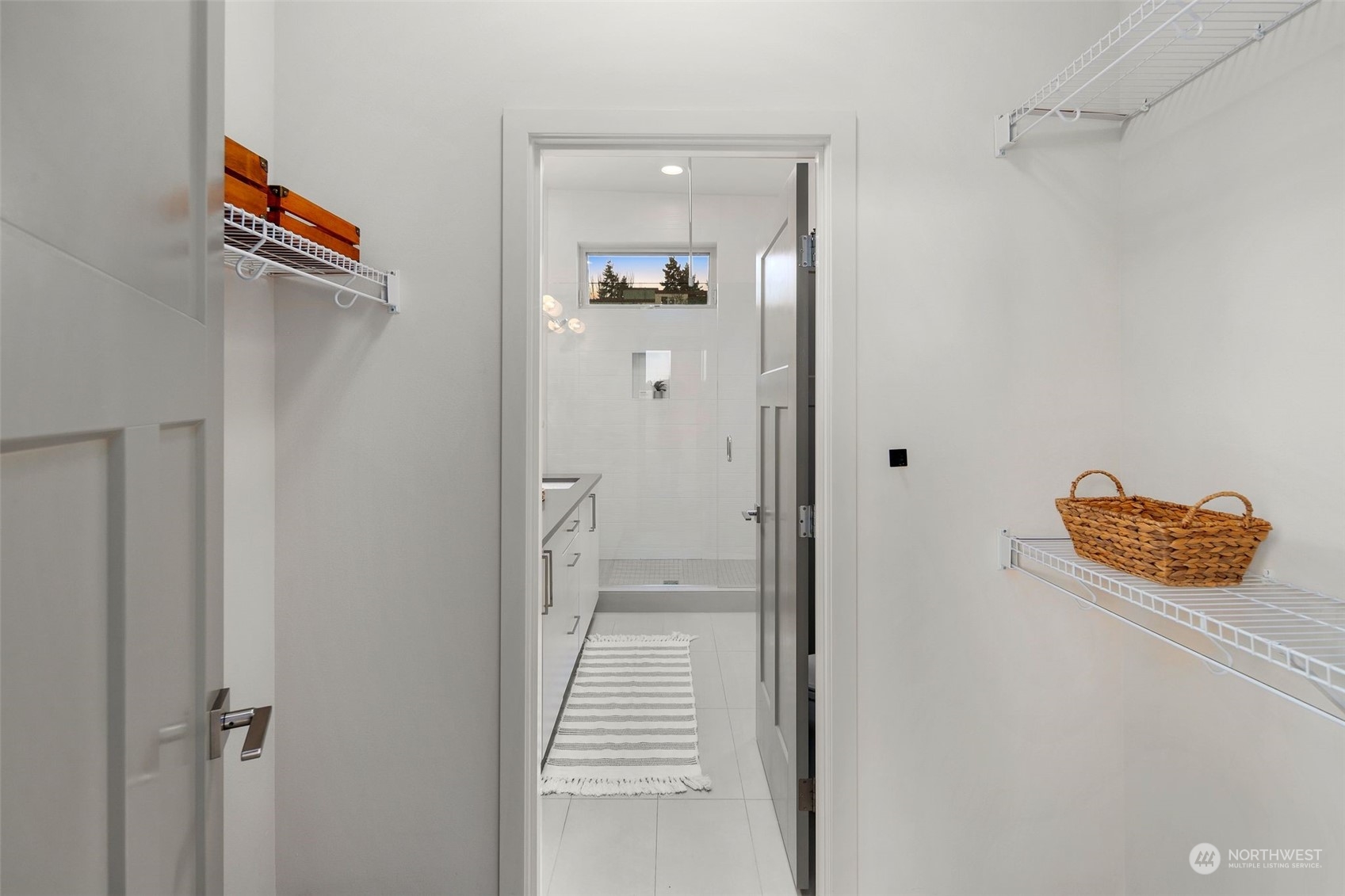 3625 Evanston Avenue North, Unit B Seattle, WA 98103 - Photo 19 of 37 a view of a hallway with wooden floor and a bathroom