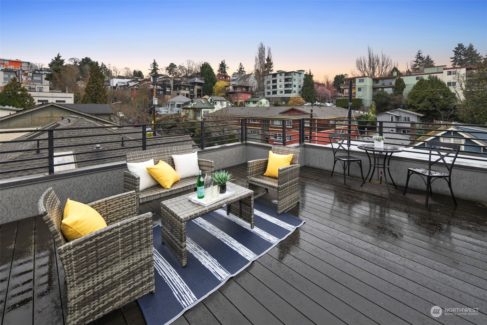 3625 Evanston Avenue North, Unit B Seattle, WA 98103 - Photo 25 of 37 a view of a rooftop deck with couch and chairs