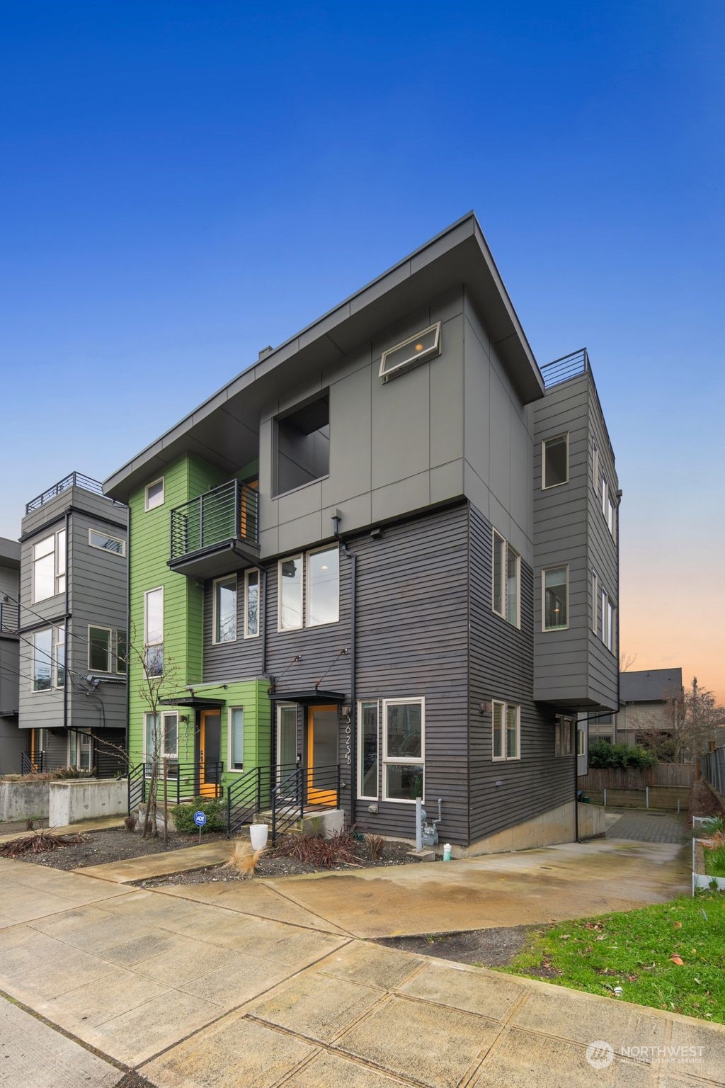 3625 Evanston Avenue North, Unit B Seattle, WA 98103 - Photo 37 of 37 a front view of residential houses with yard