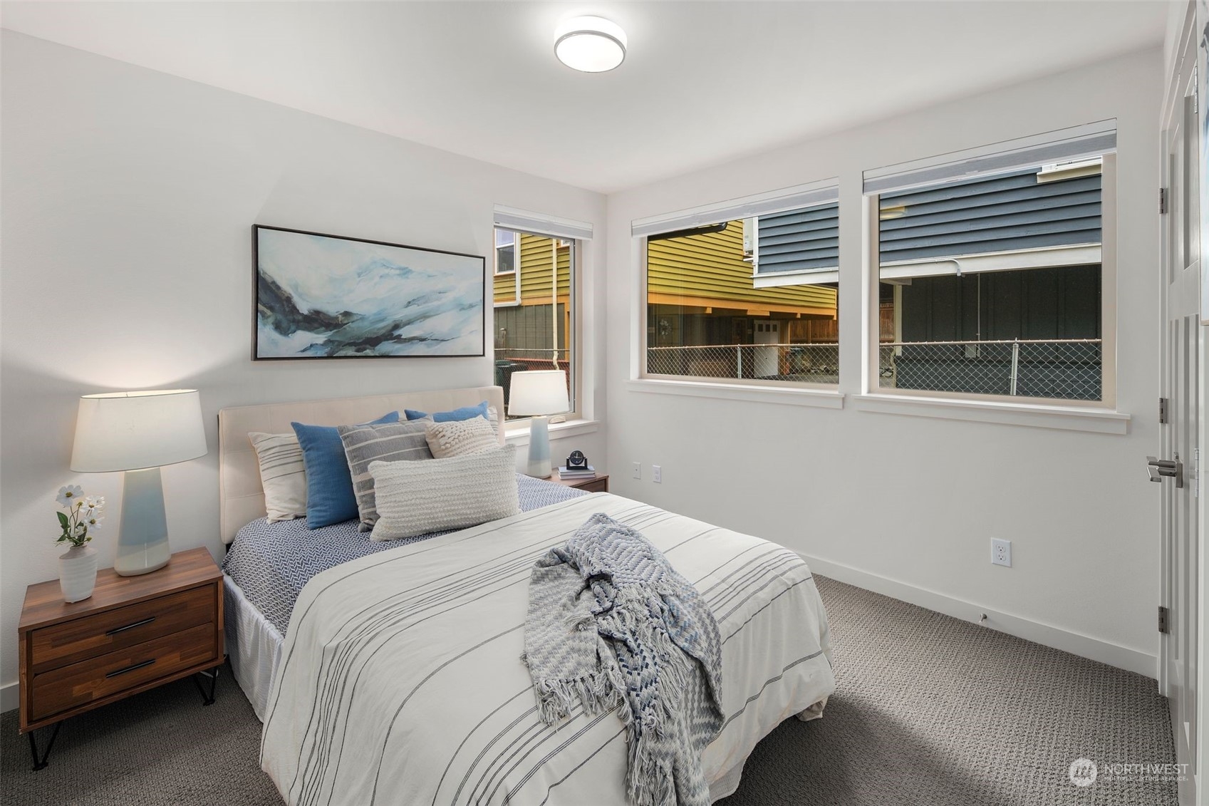 3625 Evanston Avenue North, Unit B Seattle, WA 98103 - Photo 6 of 37 a bedroom with a bed and a large window