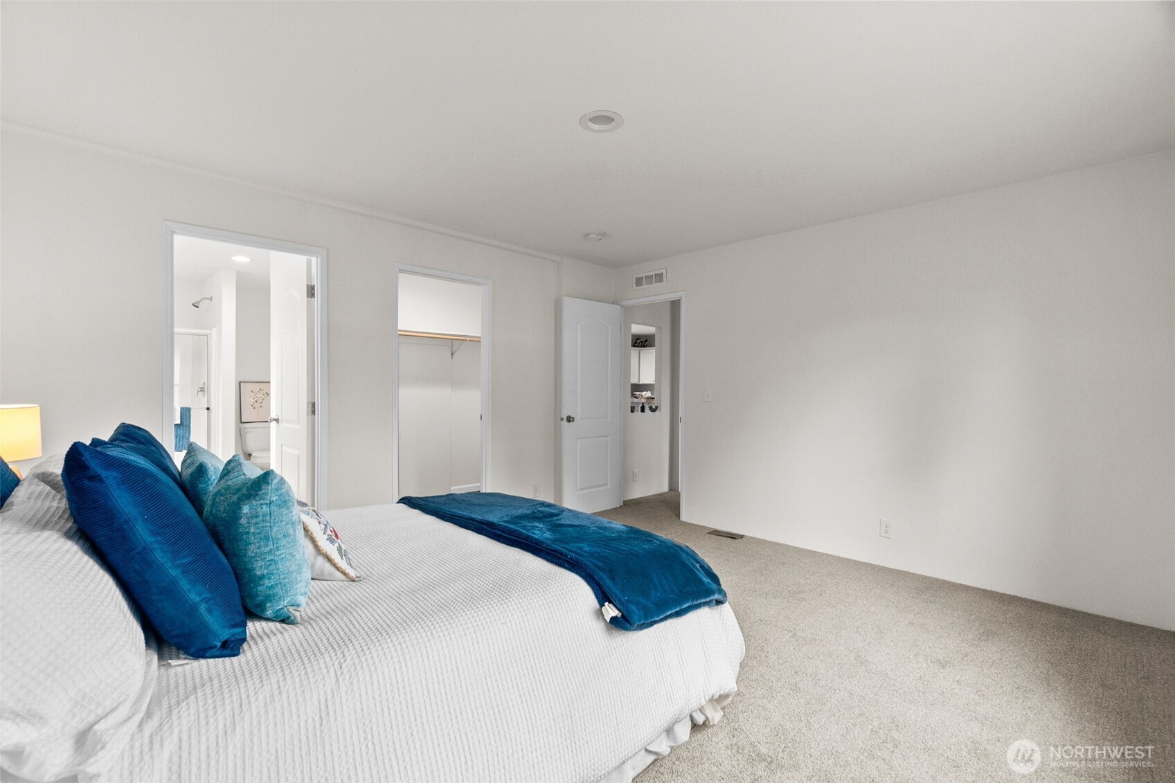 6748 Fir Tree Road Southeast, Unit 15 Olympia, WA 98513 - Photo 17 of 28 a bedroom with a bed and a couch