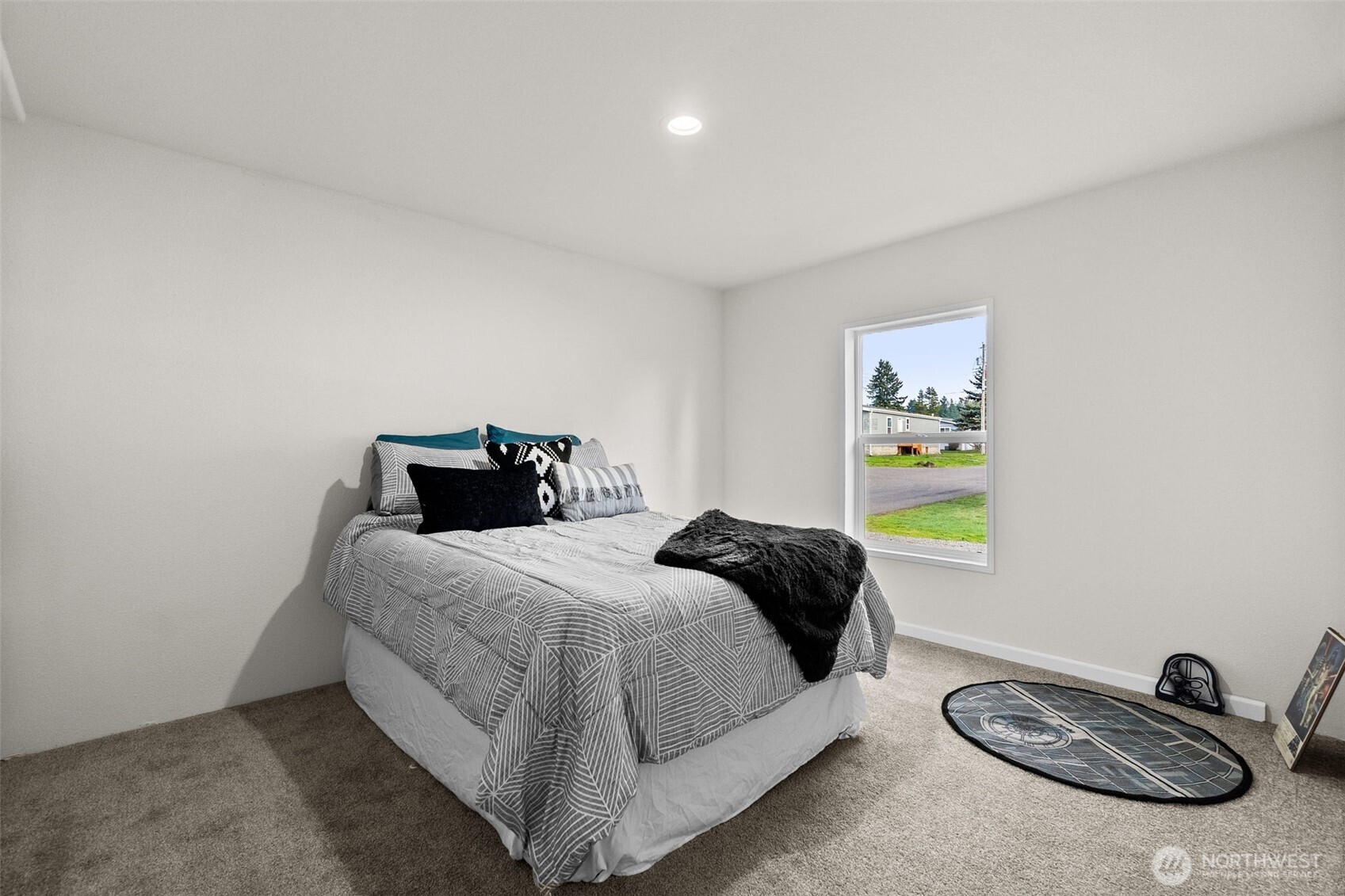 6748 Fir Tree Road Southeast, Unit 15 Olympia, WA 98513 - Photo 20 of 28 a bedroom with bed and window