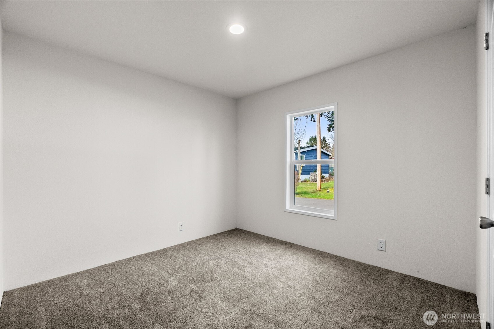 6748 Fir Tree Road Southeast, Unit 15 Olympia, WA 98513 - Photo 23 of 28 an empty room with window and glass door