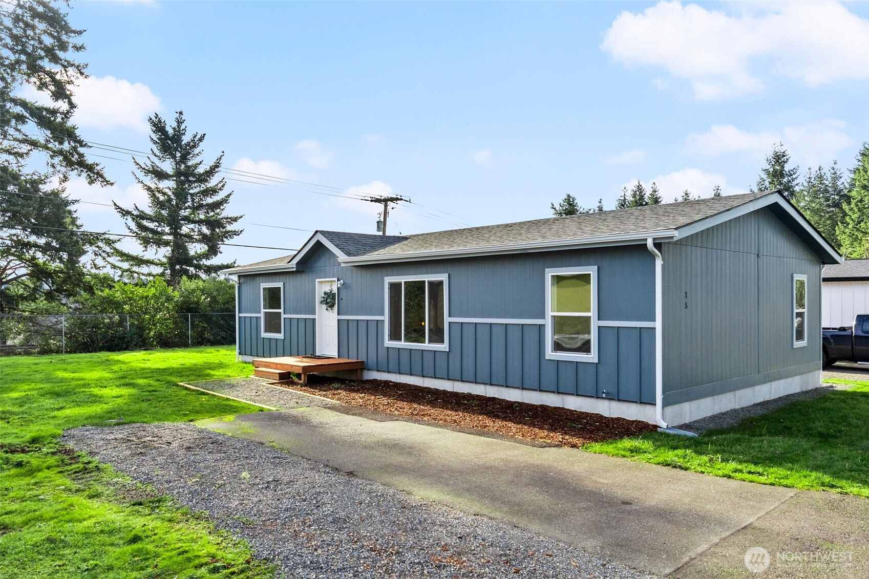 6748 Fir Tree Road Southeast, Unit 15 Olympia, WA 98513 - Photo 27 of 28 a view of a house with a yard and wooden fence