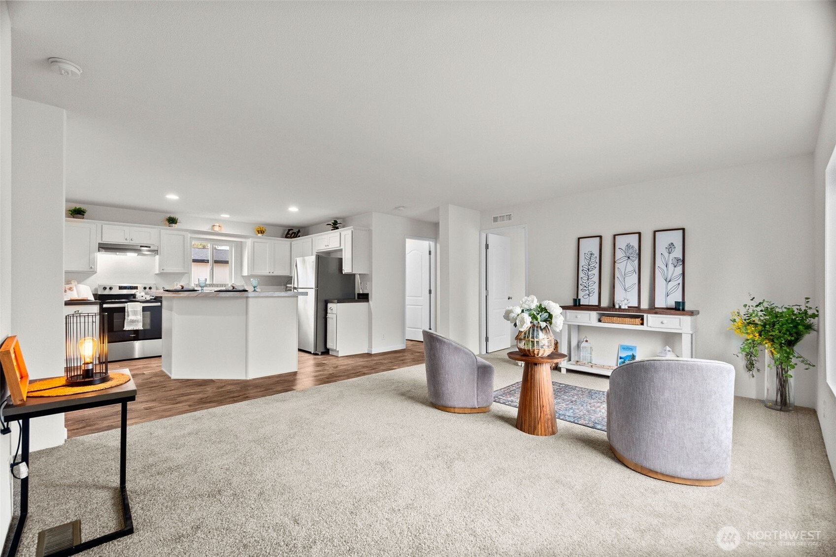 6748 Fir Tree Road Southeast, Unit 15 Olympia, WA 98513 - Photo 4 of 28 a living room with furniture a dining table and kitchen view