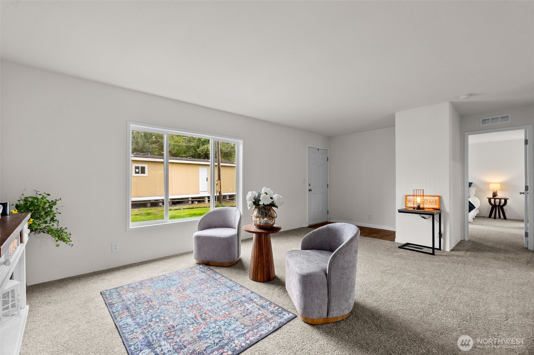 6748 Fir Tree Road Southeast, Unit 15 Olympia, WA 98513 - Photo 6 of 28 a living room with furniture and a window