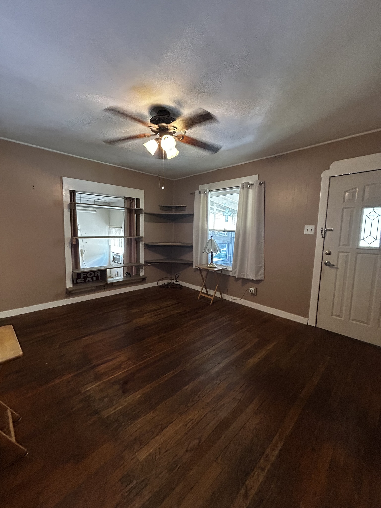 5702 Duval Street Austin, TX 78752 - Photo 17 of 31 Living space featuring rich wood-finish flooring and a ceiling fan with integrated lighting