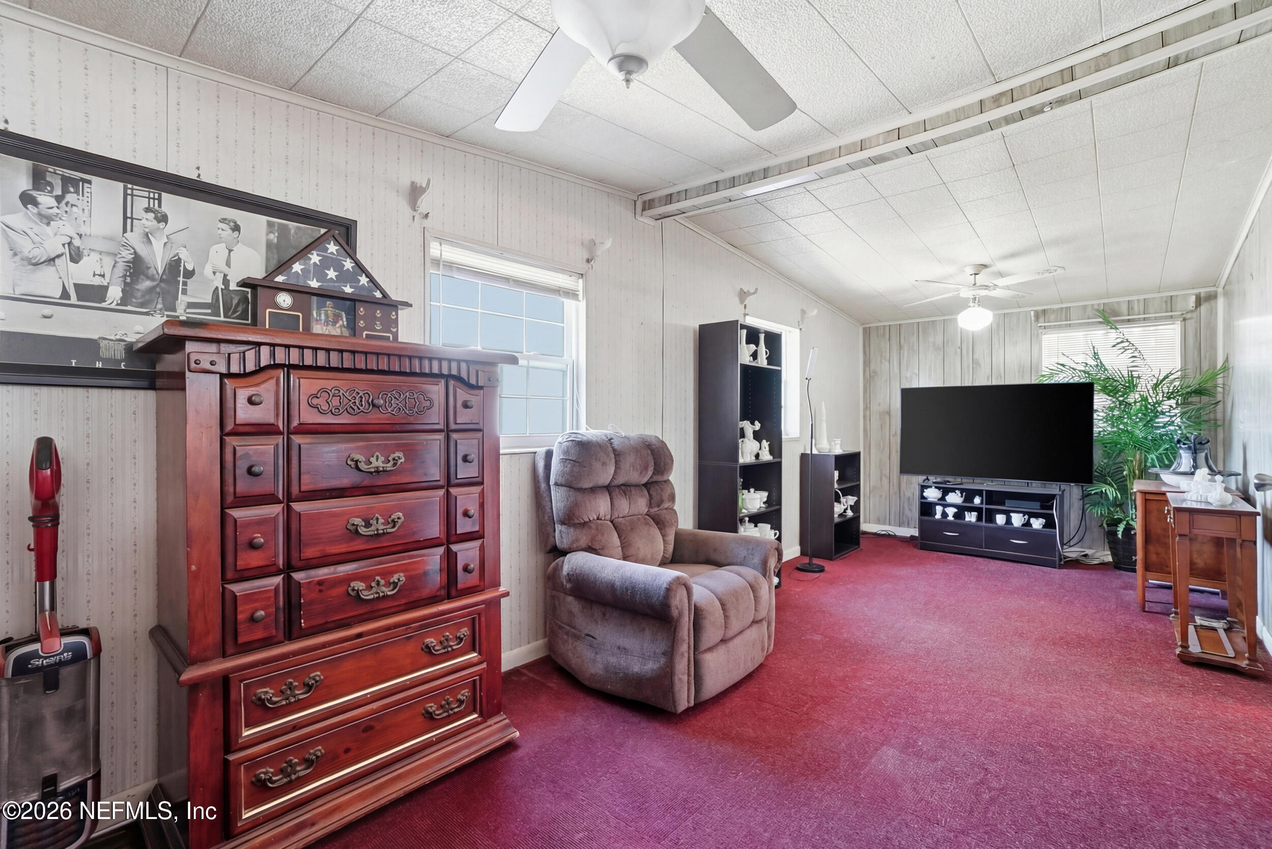 43 Forrestal Circle North Atlantic Beach, FL 32233 - Photo 14 of 39 a living room with furniture and a flat screen tv