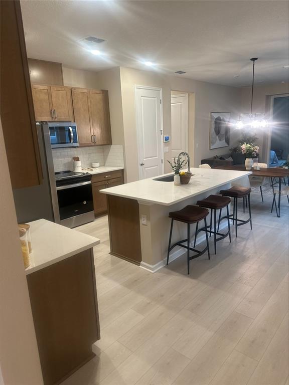 1026 Swamp Chestnut Loop Lady Lake, FL 32159 - Photo 6 of 19 a large kitchen with a table and chairs