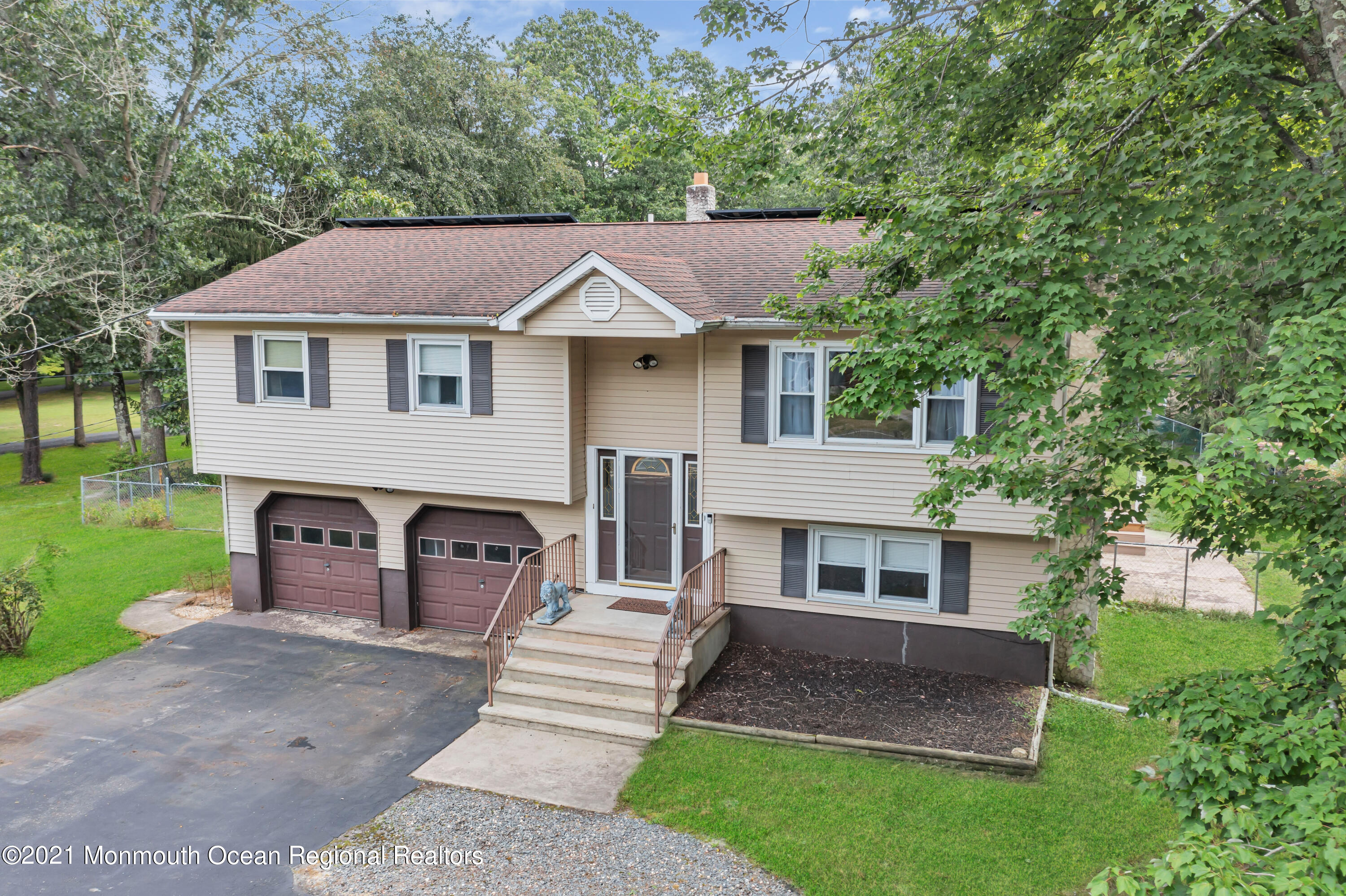 87 Jackson Mills Road Jackson, NJ 08527 - Photo 1 of 32 a front view of a house with a garden