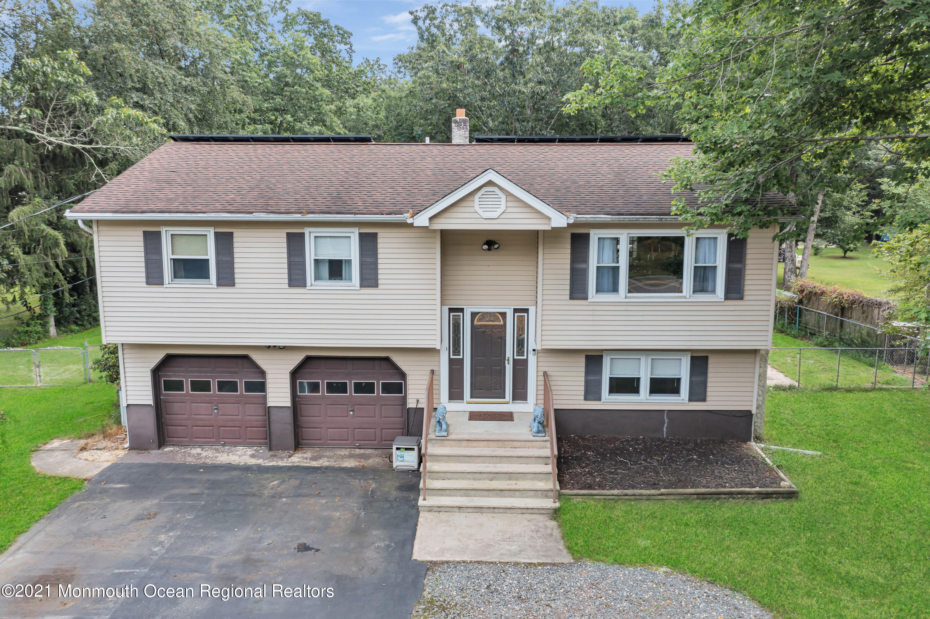 87 Jackson Mills Road Jackson, NJ 08527 - Photo 2 of 32 a front view of a house with a yard