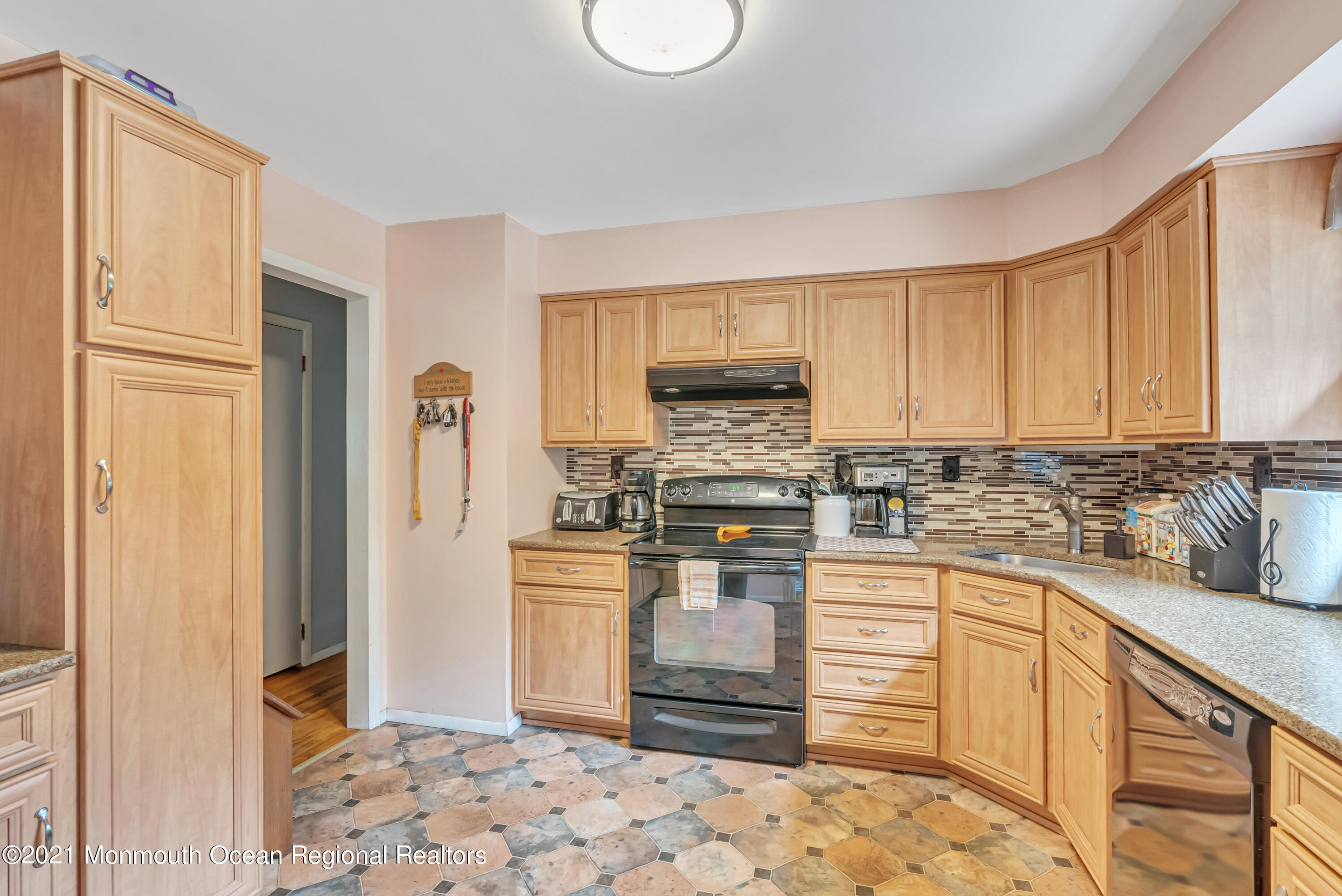87 Jackson Mills Road Jackson, NJ 08527 - Photo 11 of 32 a kitchen with stainless steel appliances granite countertop a refrigerator sink and cabinets