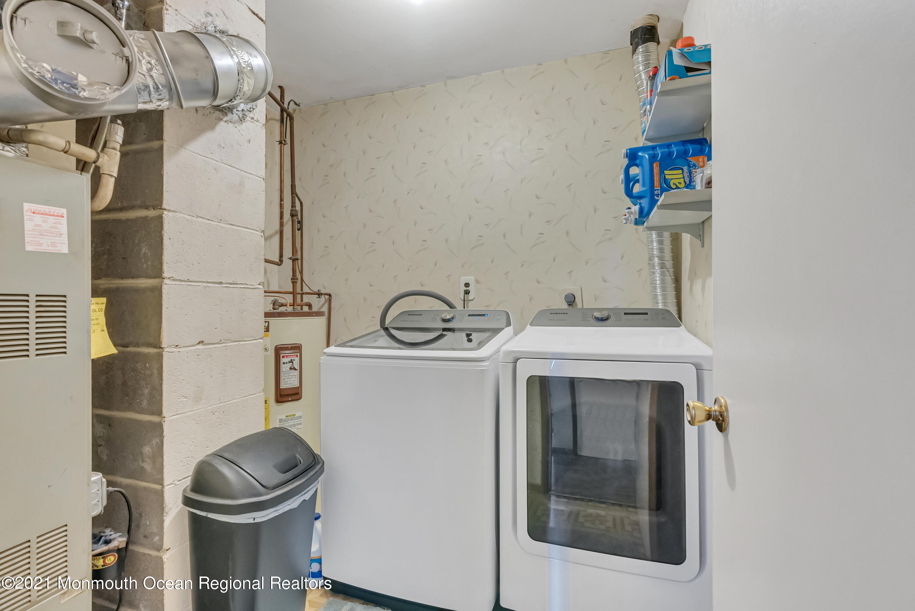 87 Jackson Mills Road Jackson, NJ 08527 - Photo 29 of 32 a bathroom with a sink and a washing machine