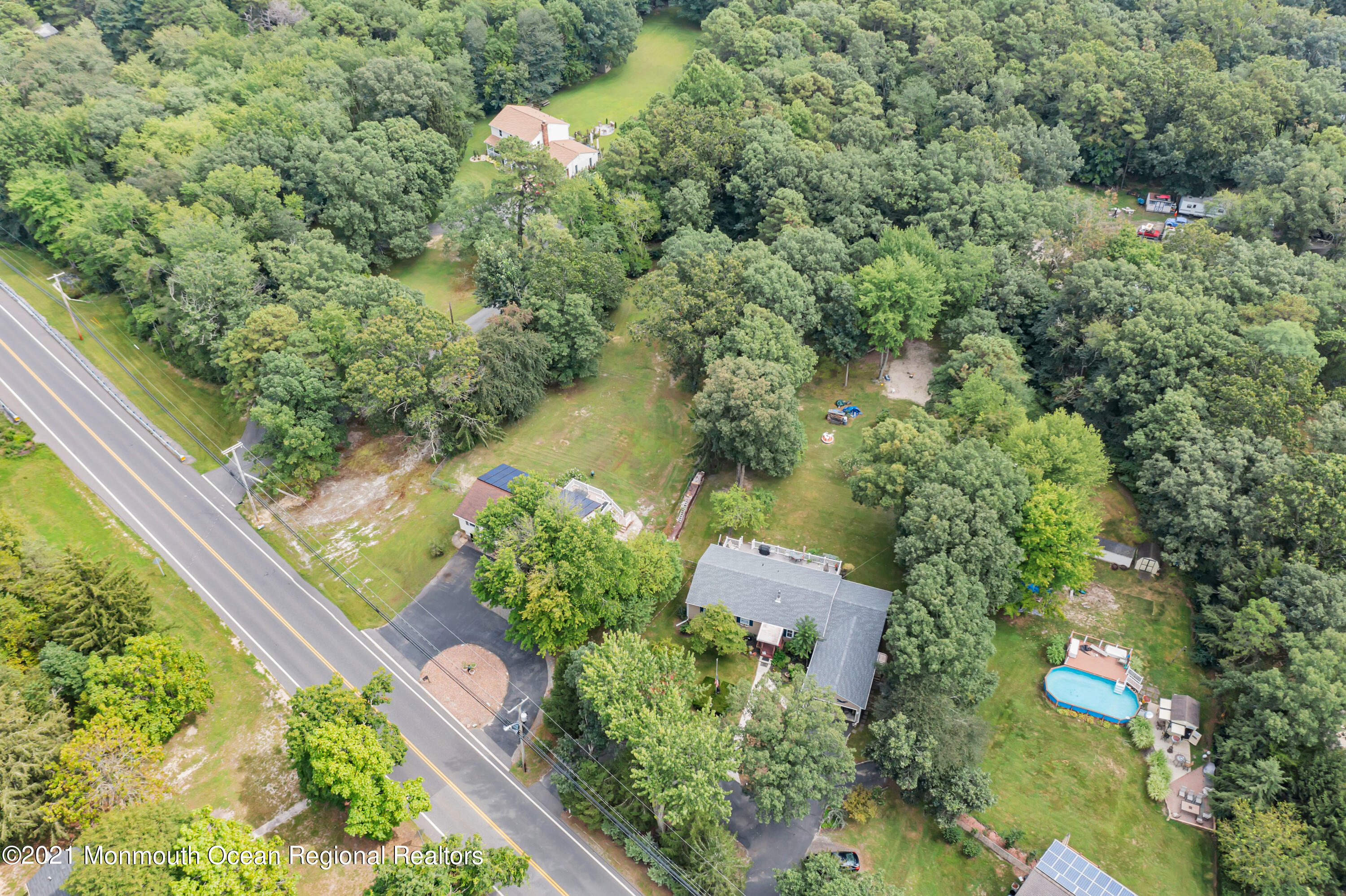 87 Jackson Mills Road Jackson, NJ 08527 - Photo 6 of 32 an aerial view of a house with a yard