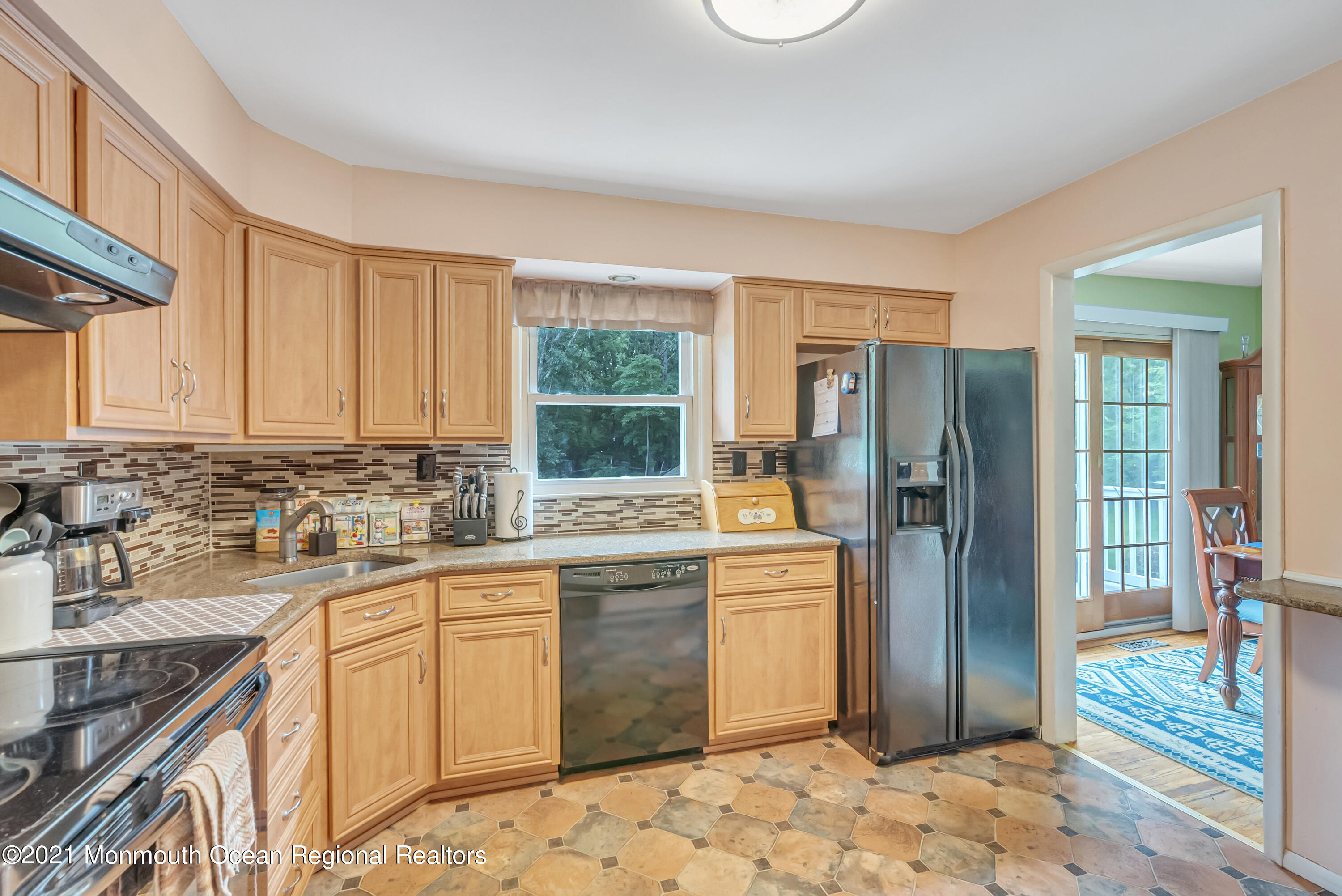 87 Jackson Mills Road Jackson, NJ 08527 - Photo 10 of 32 a kitchen with a sink stove and refrigerator