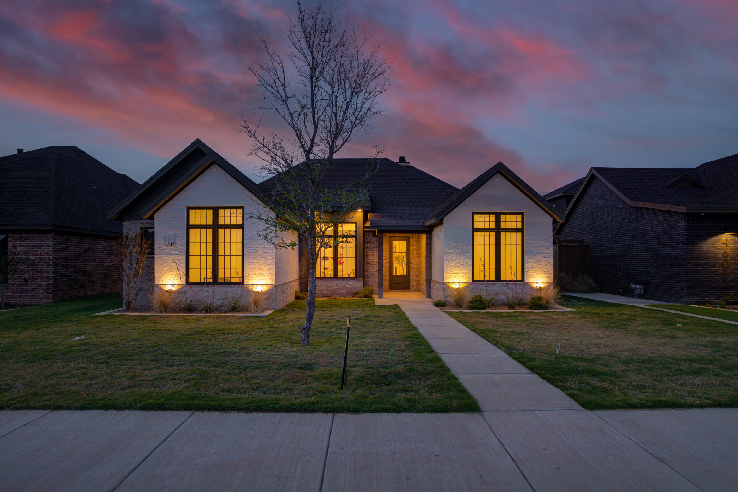 4610 138th Place Lubbock, TX 79424 - Photo 1 of 52 a front view of a house with a garden