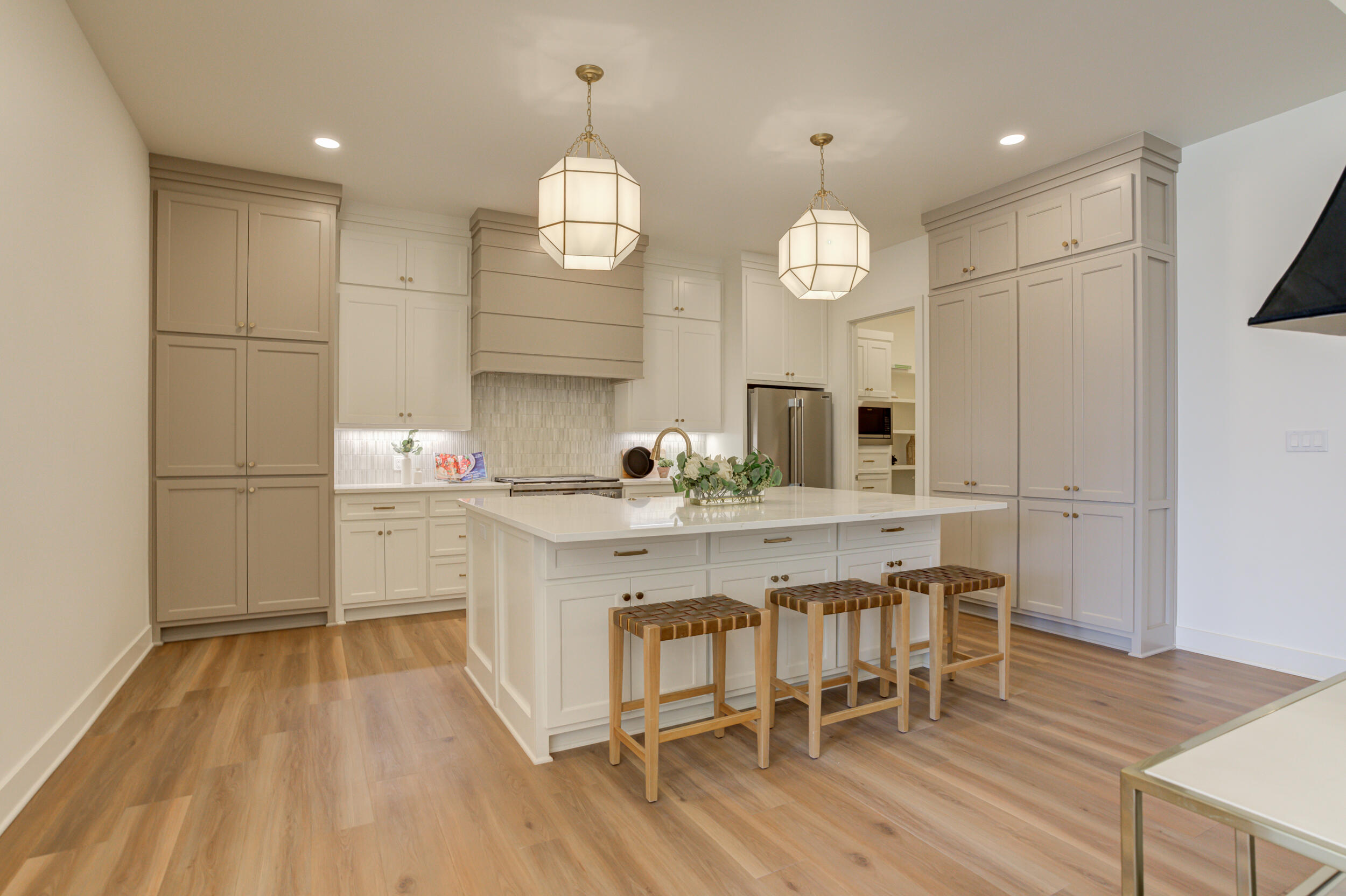 4610 138th Place Lubbock, TX 79424 - Photo 12 of 52 a kitchen with sink cabinets and wooden floor