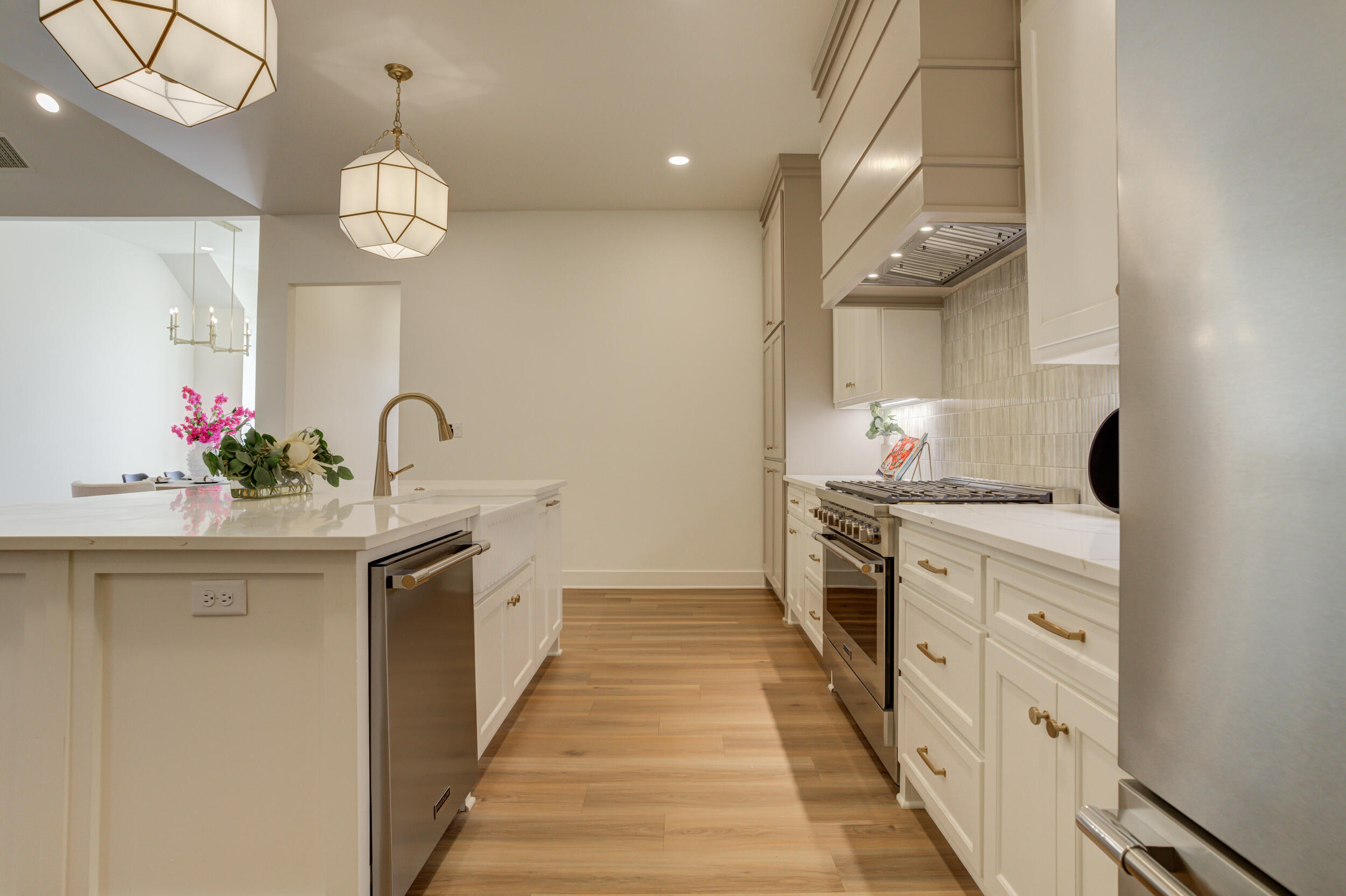 4610 138th Place Lubbock, TX 79424 - Photo 15 of 52 a kitchen with white cabinets and sink