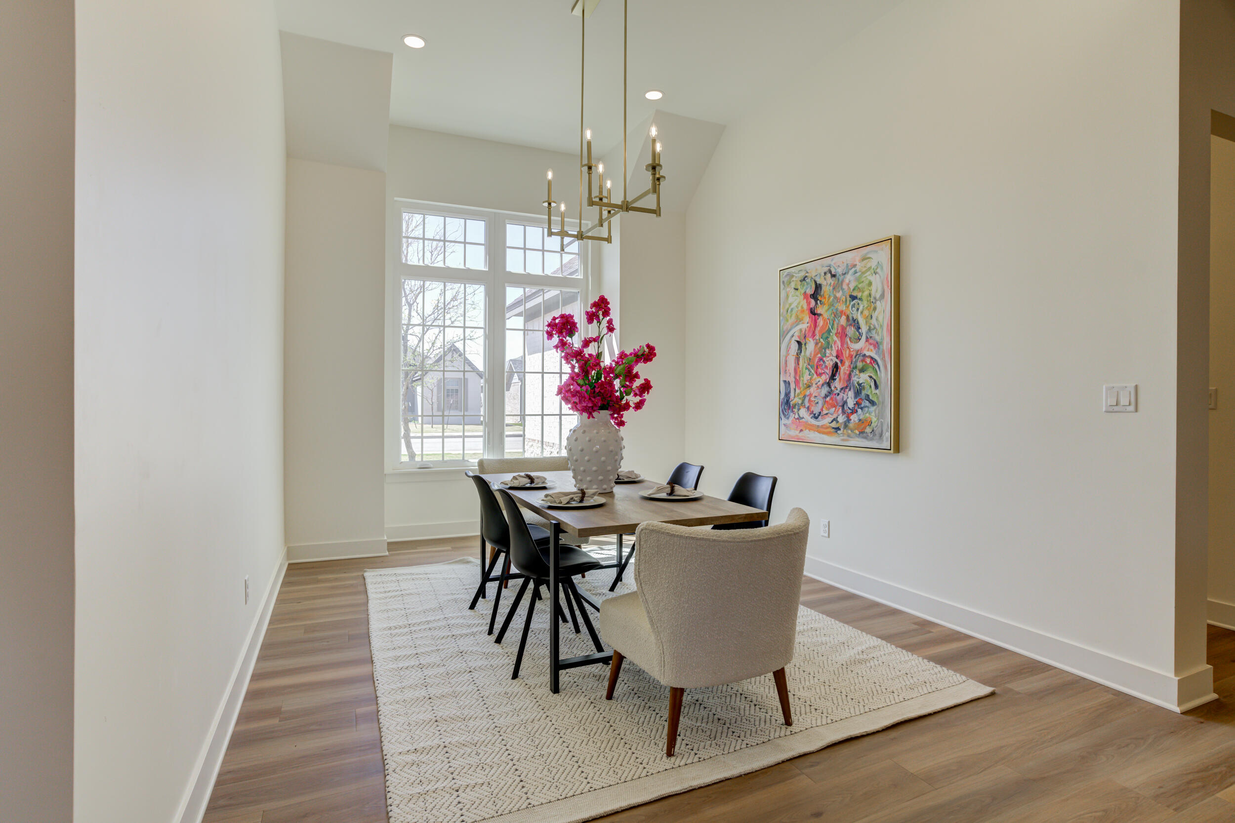 4610 138th Place Lubbock, TX 79424 - Photo 22 of 52 a view of a dining room with furniture and chandelier