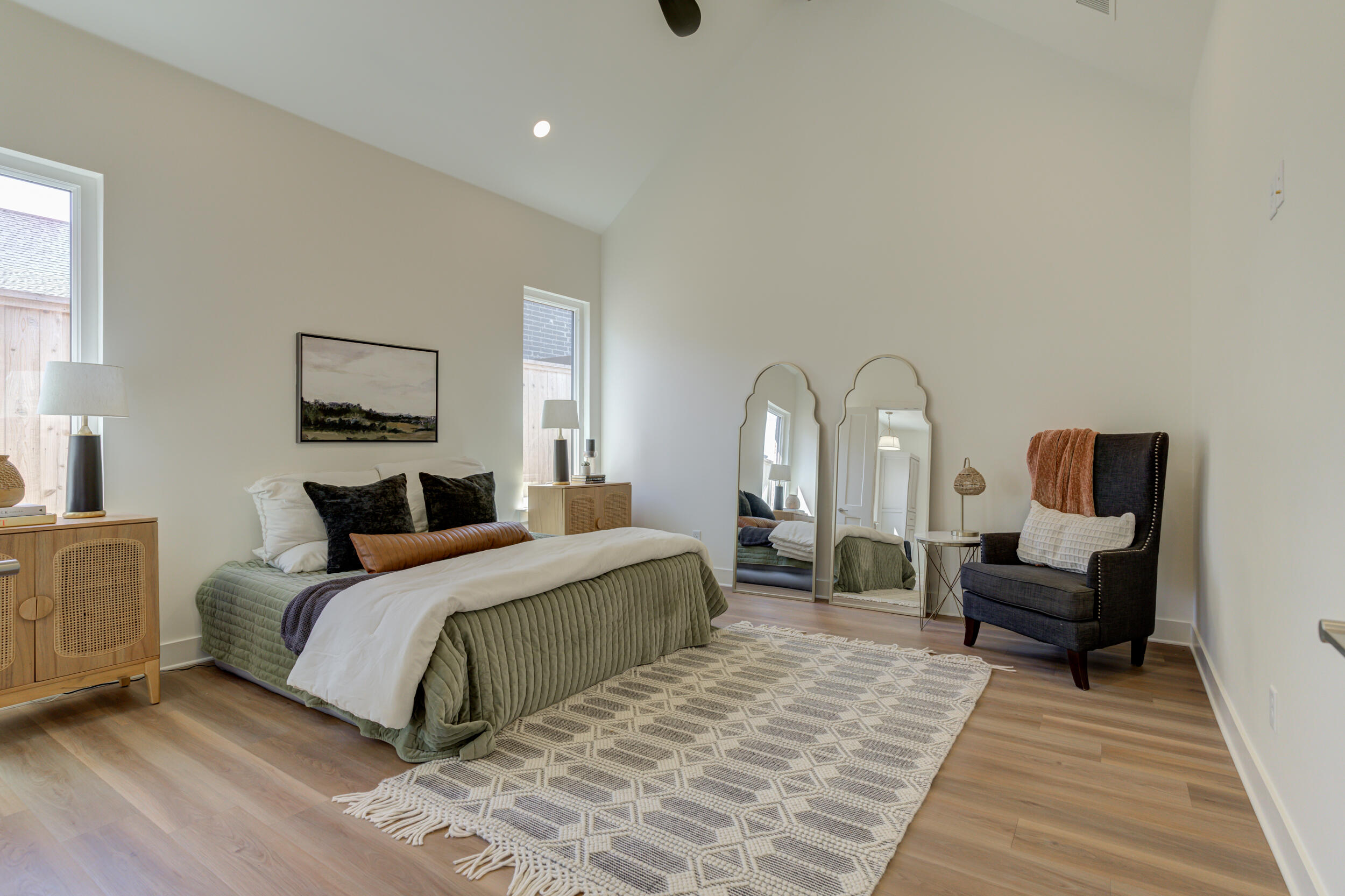 4610 138th Place Lubbock, TX 79424 - Photo 25 of 52 a bedroom with a bed wooden floor and furniture