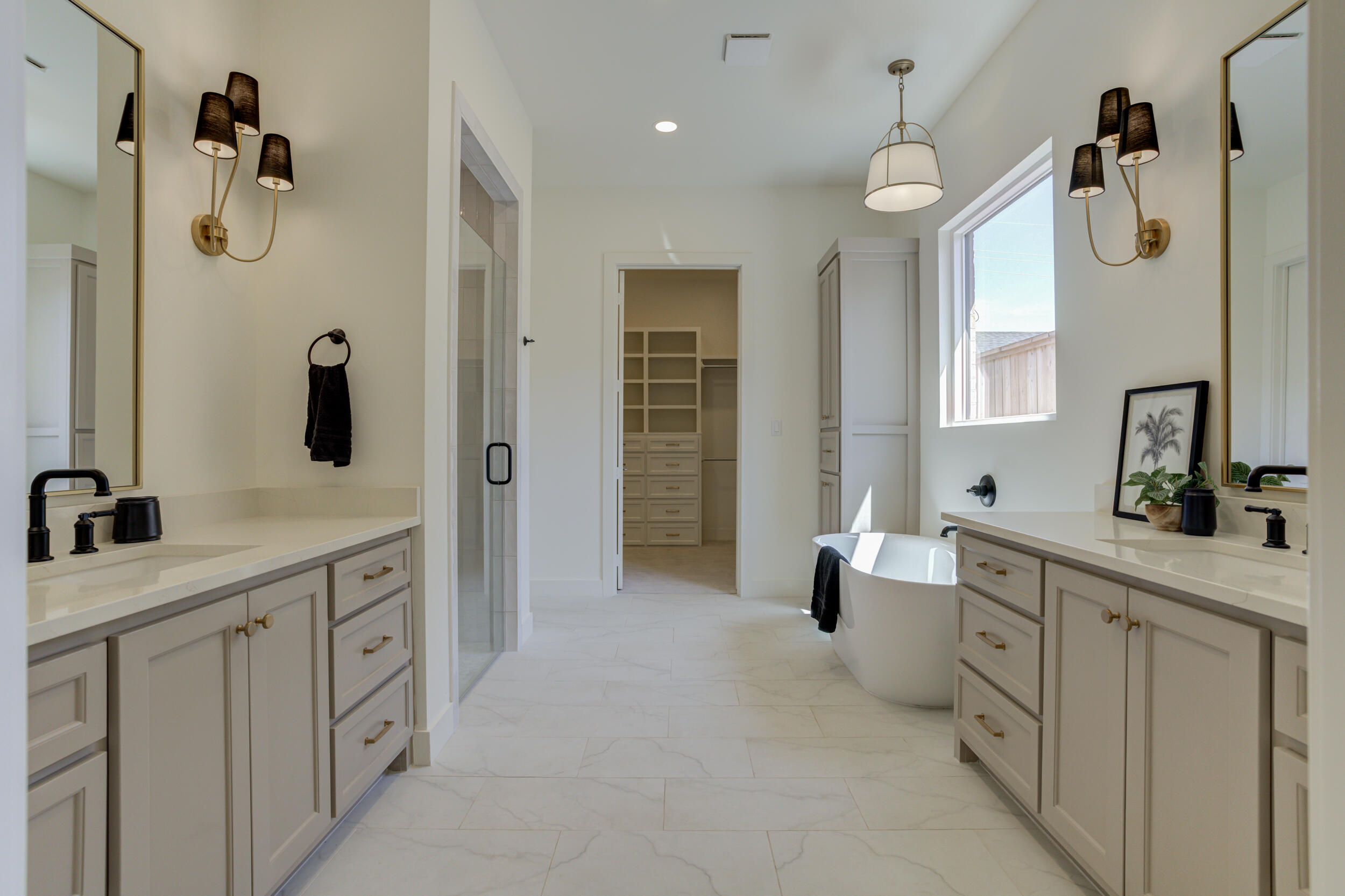 4610 138th Place Lubbock, TX 79424 - Photo 29 of 52 a spacious bathroom with double sink and mirror