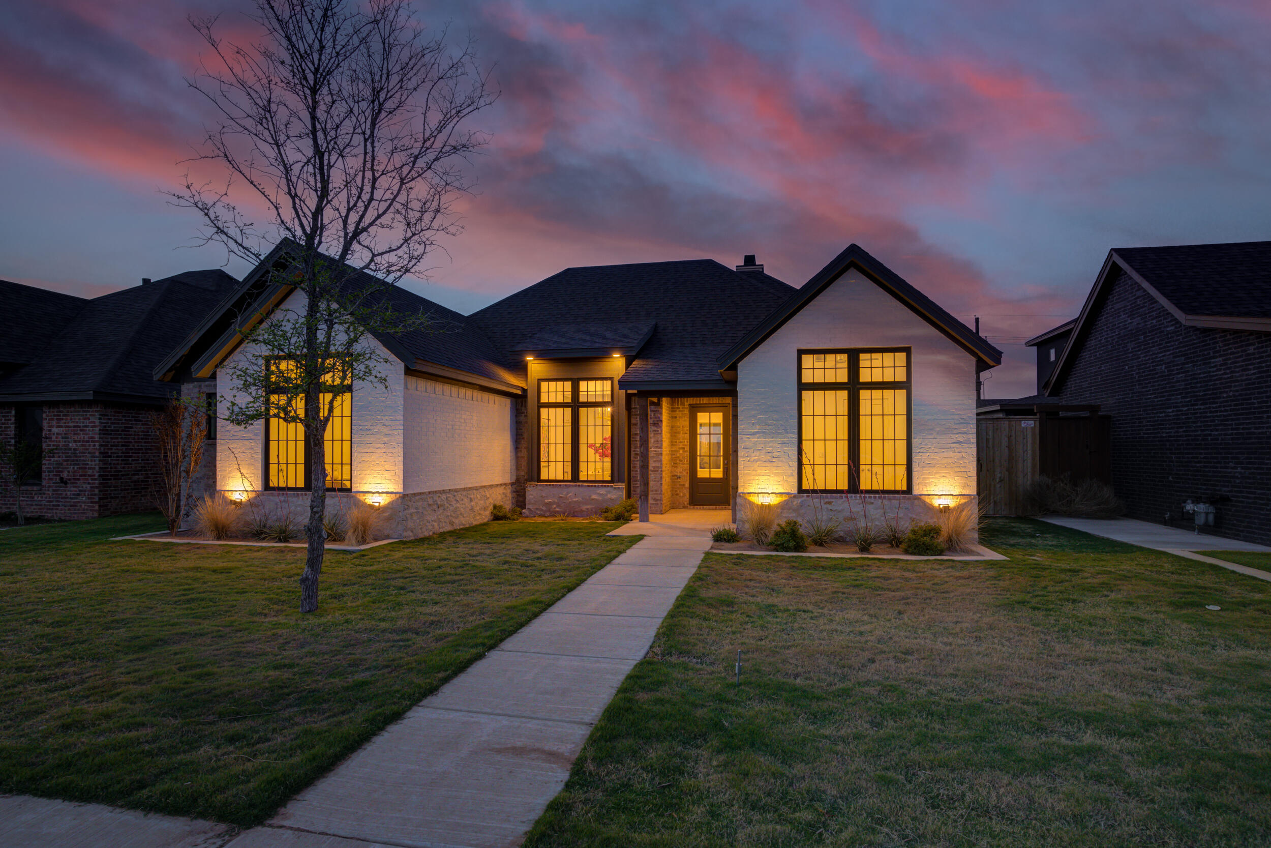 4610 138th Place Lubbock, TX 79424 - Photo 3 of 52 a front view of a house with a yard
